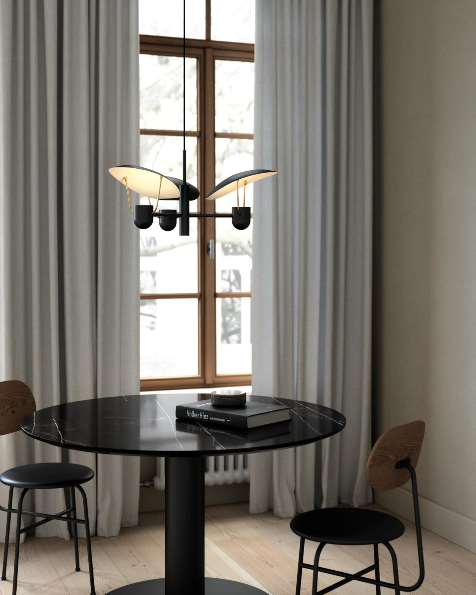 Fabiola Pendant Light in black featured above a dining table