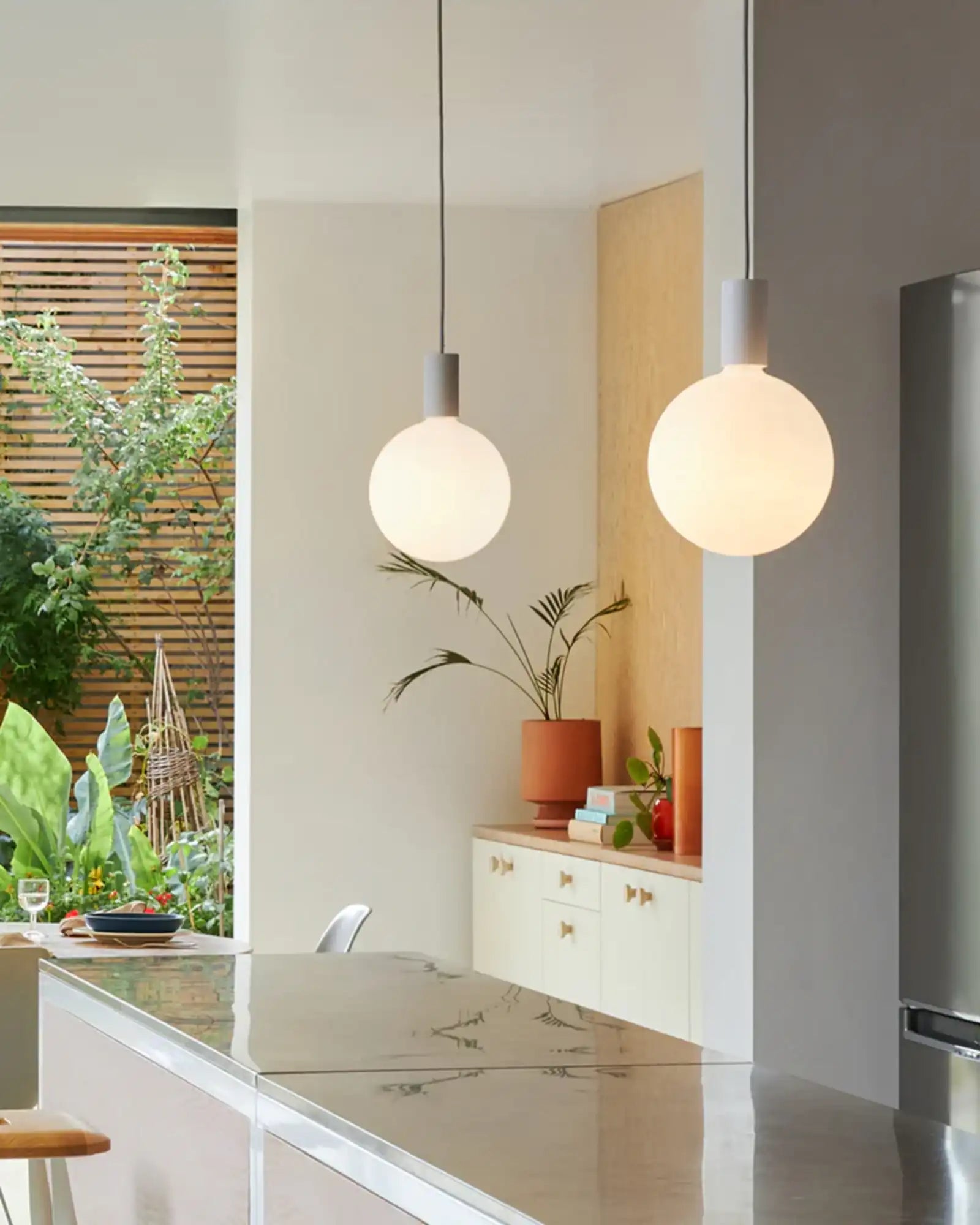 Alumina Single Pendant Light by Tala featured within a contemporary kitchen | Nook Collections