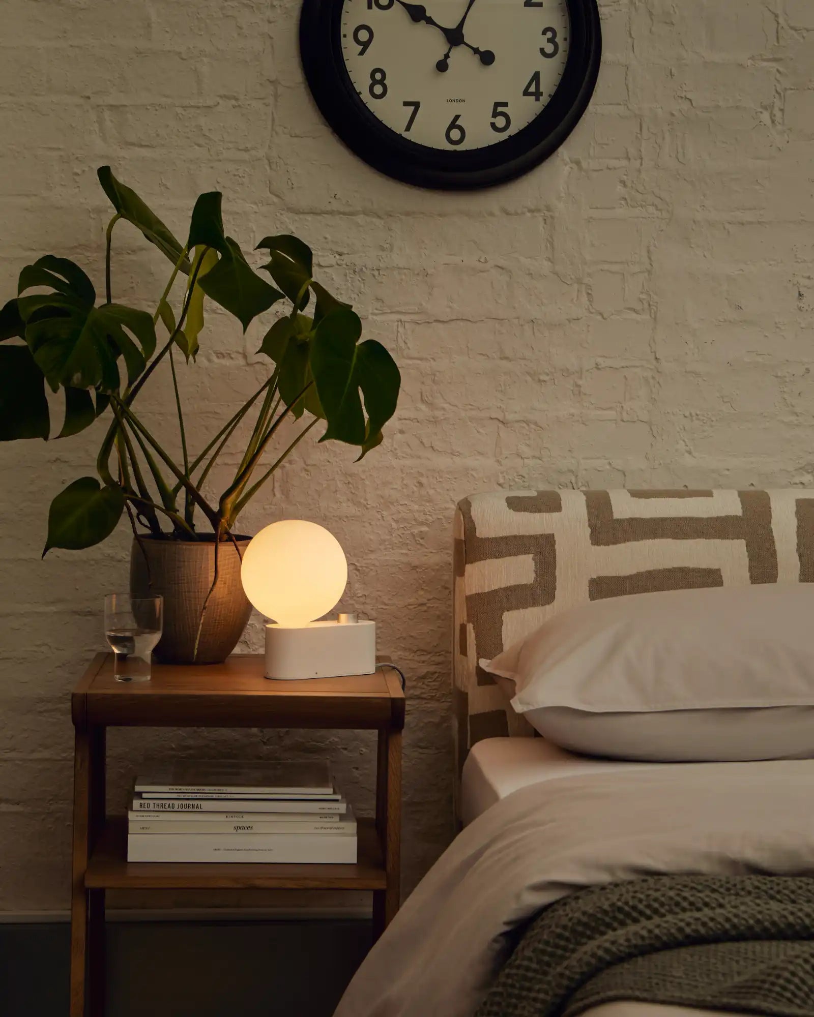 Alumina Table Lamp by Tala featured within a contemporary bedroom | Nook Collections