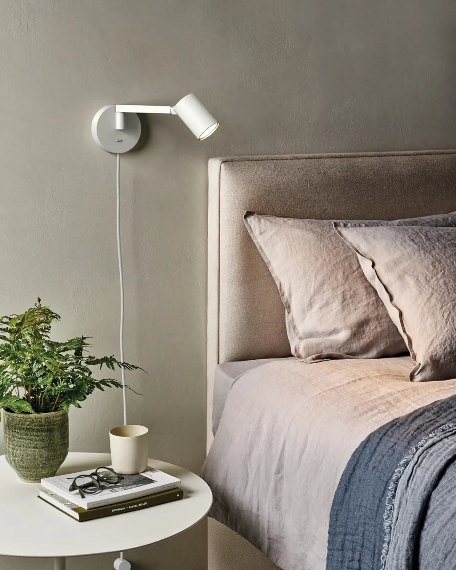 Ascoli Swing Plug In Wall Light by Astro Lighting featured within a contemporary bedroom | Nook Collections