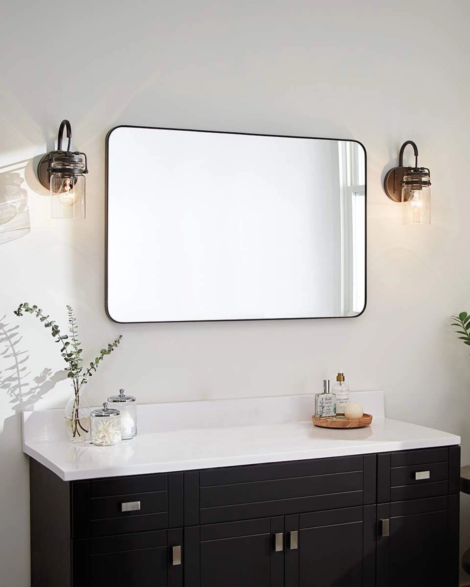 Brinley Wall Light by Elstead featured in a traditional bathroom | Nook Collections