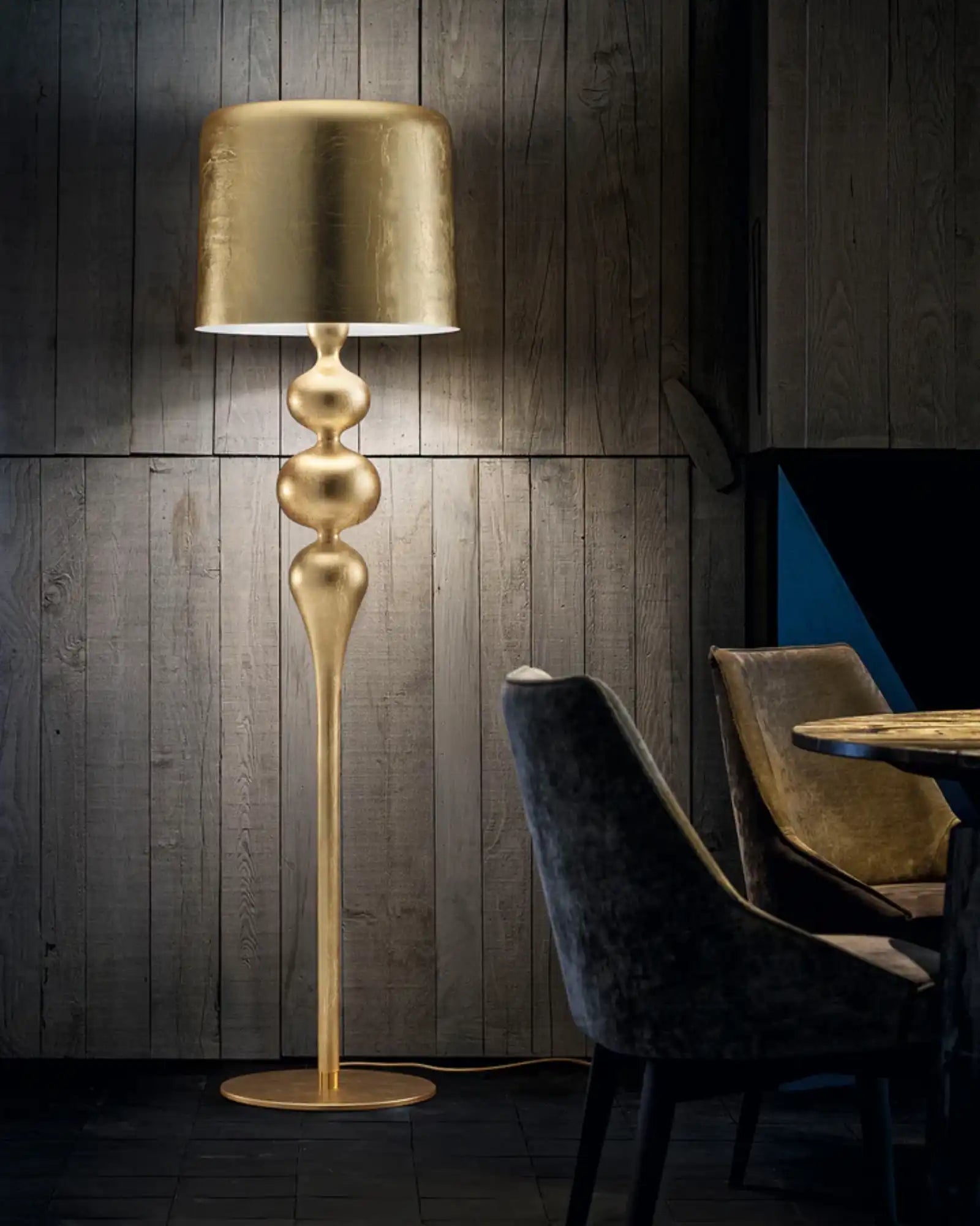 Eva Floor Lamp by Masiero Lighting featured within a contemporary dining room | Nook Collections