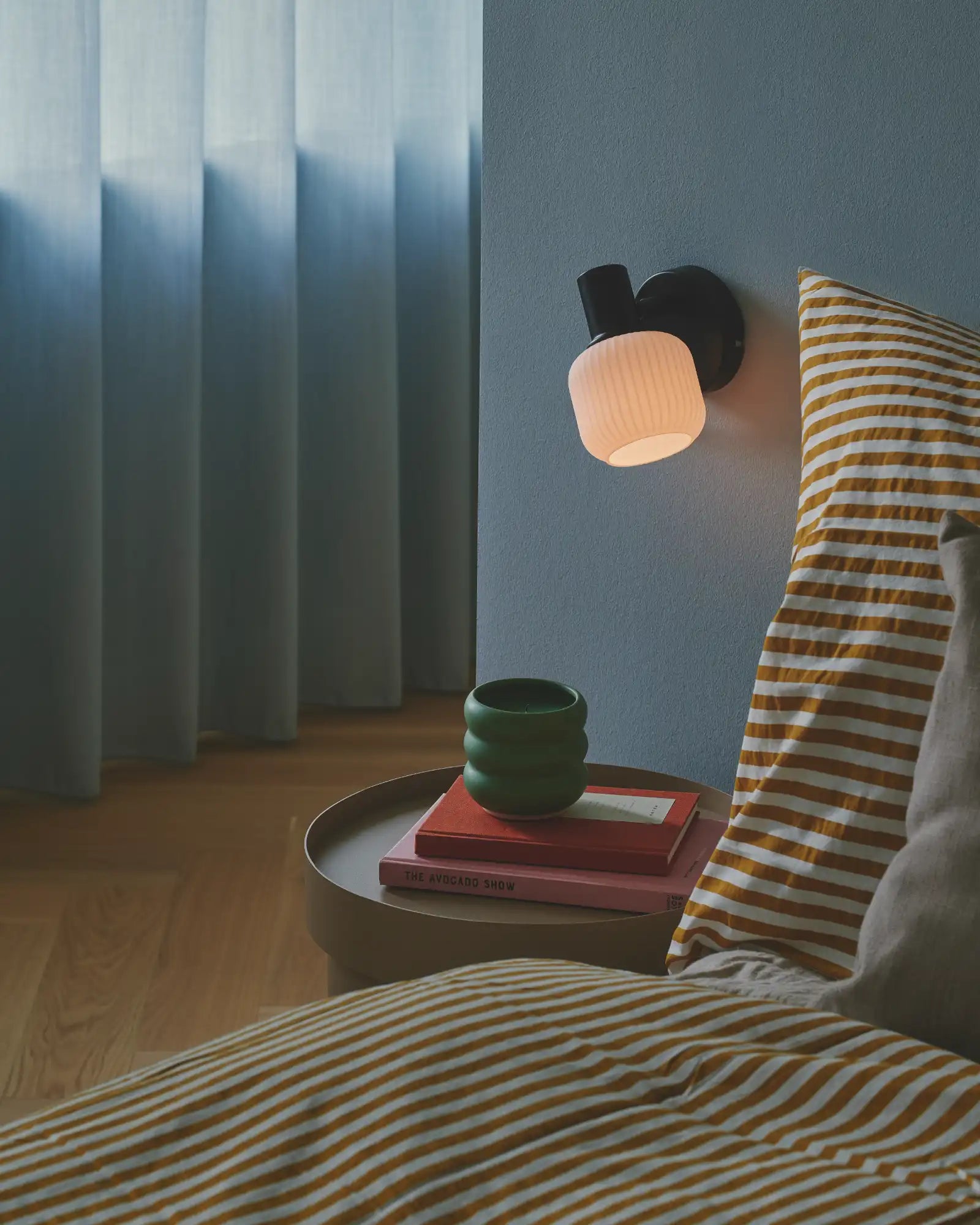 Milford Mini Wall Light by Nordlux Lighting featured within a contemporary bedroom | Nook Collections