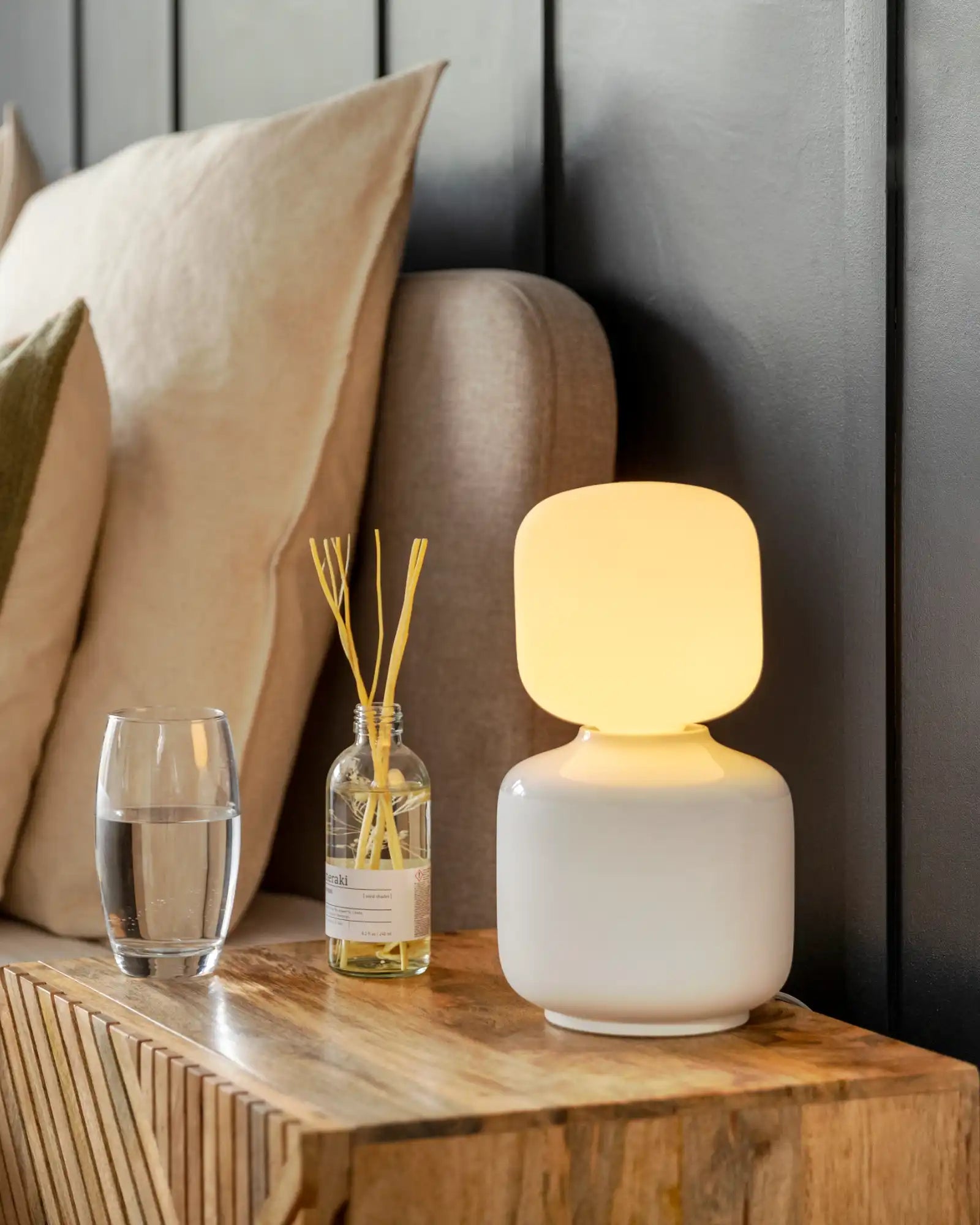 Oblo Reflection Table Lamp by Tala featured within a modern bedroom | Nook Collections