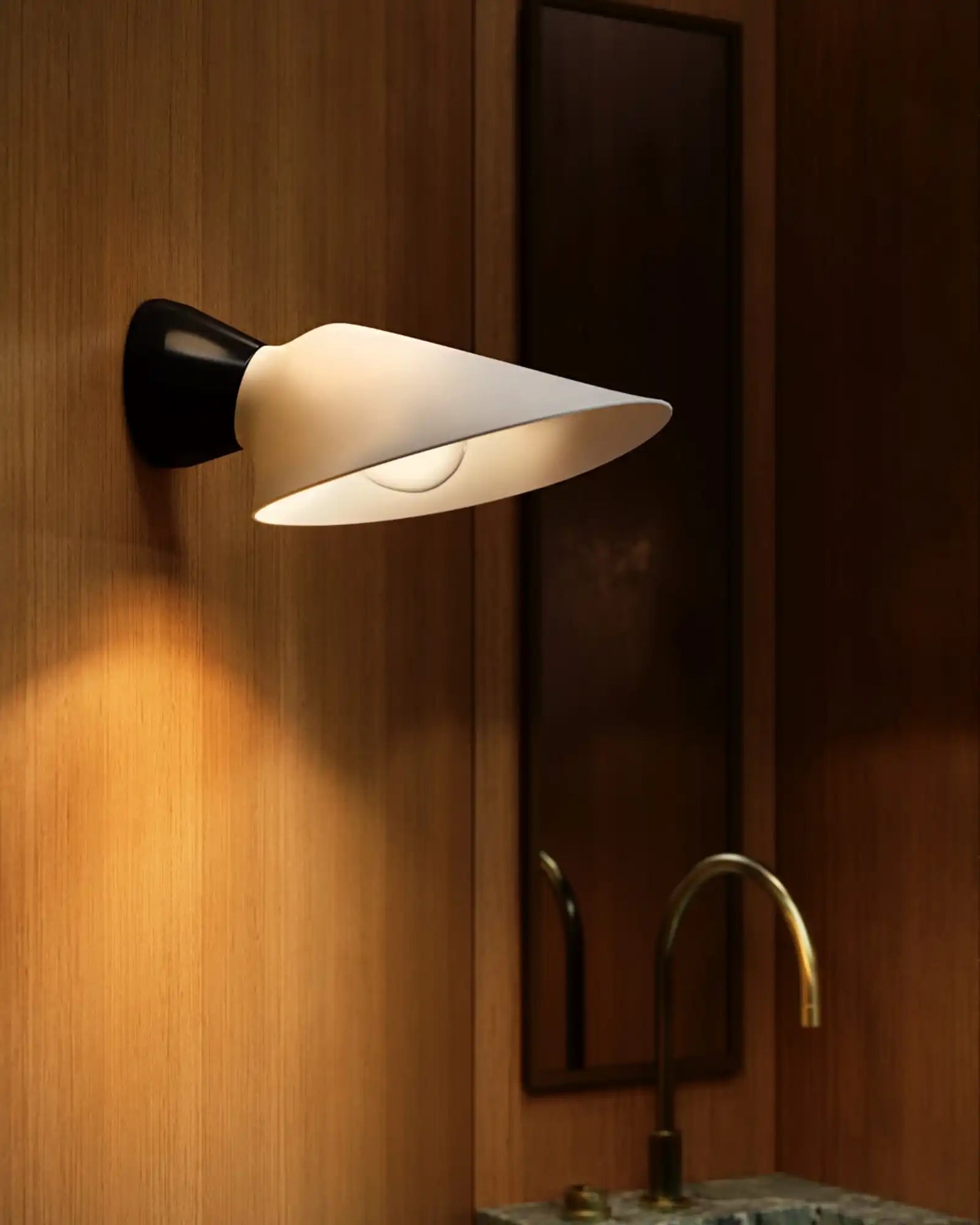 Plume Wall Light by DCW Editions featured within a contemporary bathroom | Nook Collections