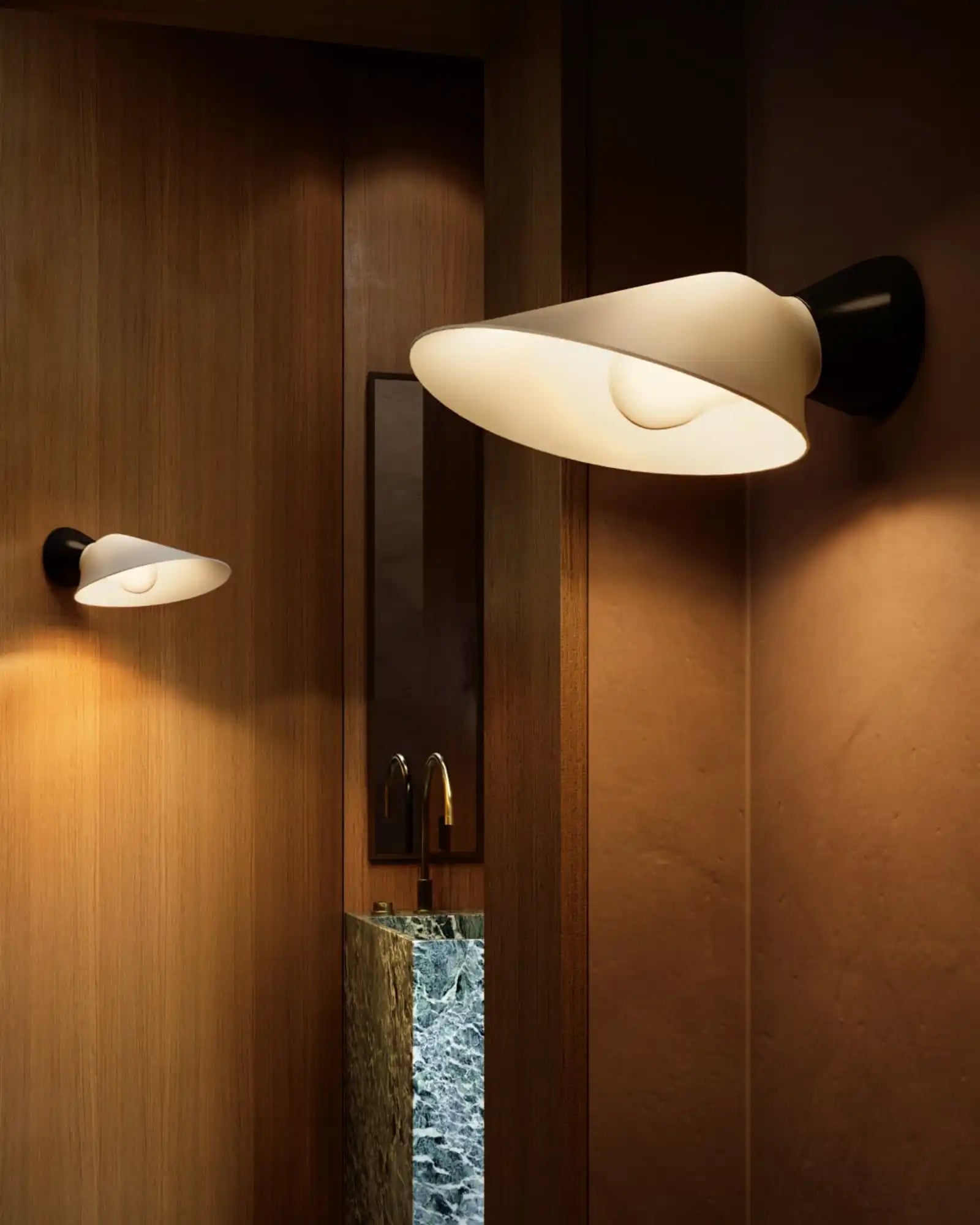 Plume Wall Light by DCW Editions featured within a contemporary bathroom | Nook Collections