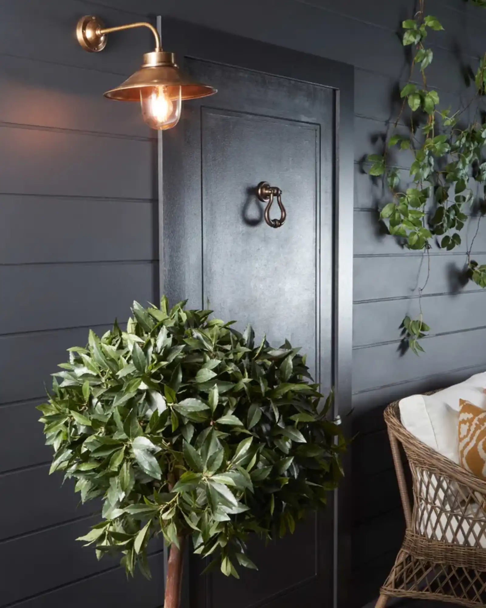 Sandhurst Wall Light by Emac & Lawton featured within a contemporary lanai | Nook Collections