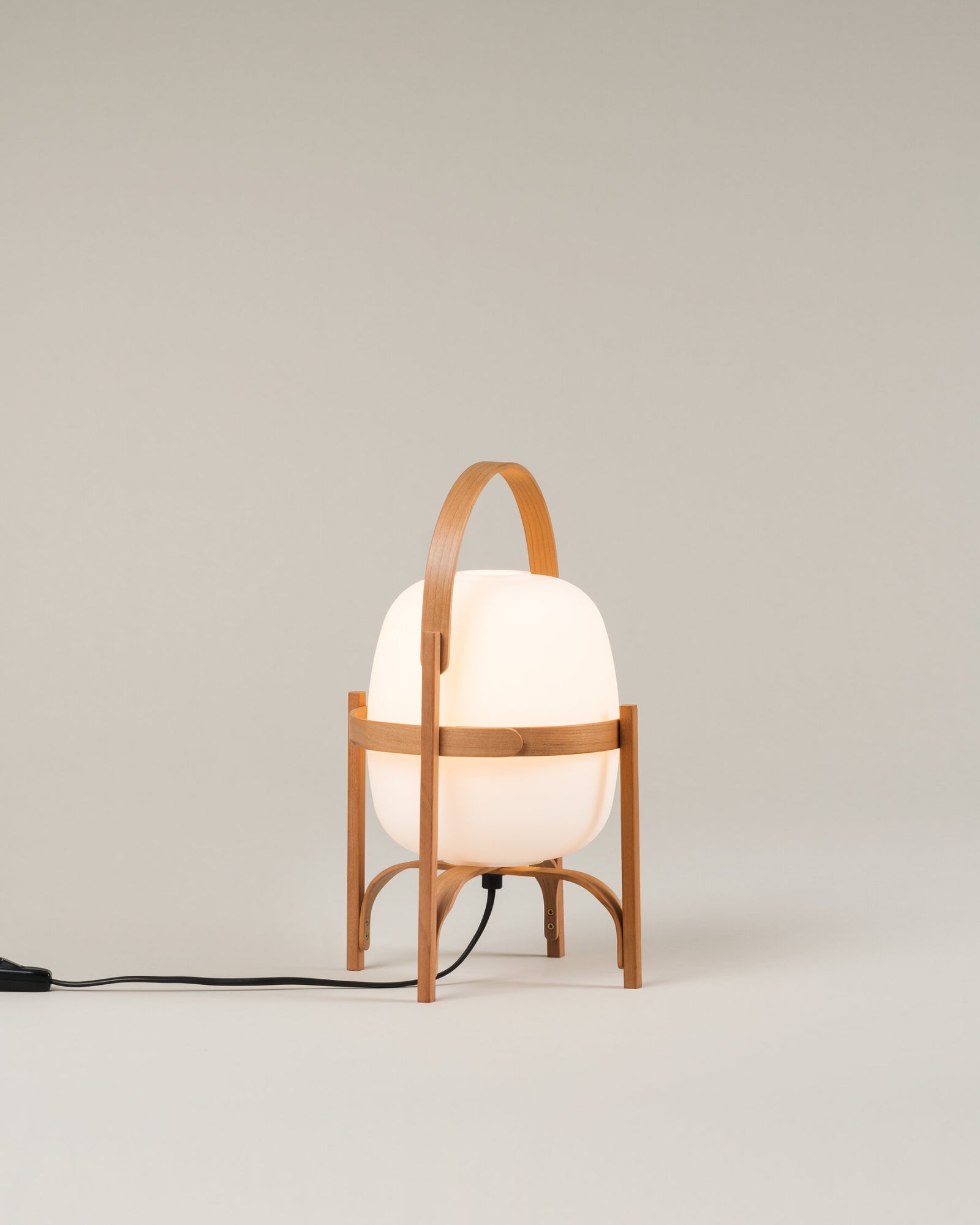 Contemporary table lamp called the Cestita Table Lamp in natural finish by Santa & Cole