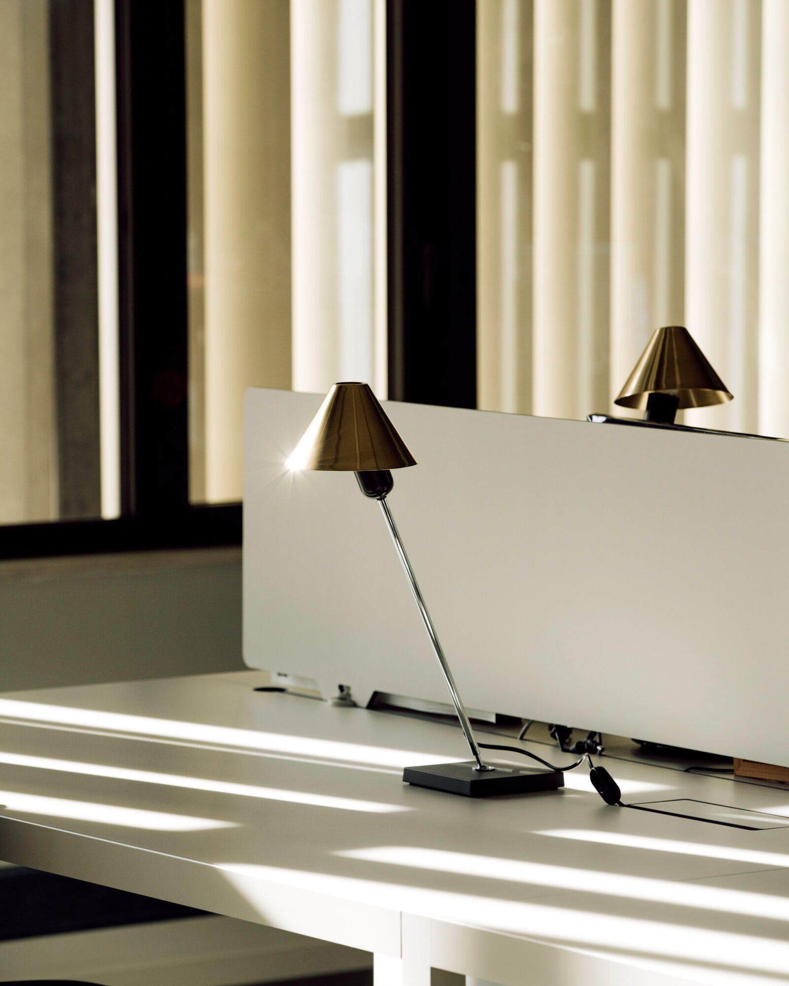 Gira Table Lamp by Santa & Cole featured within an office | Nook Collections