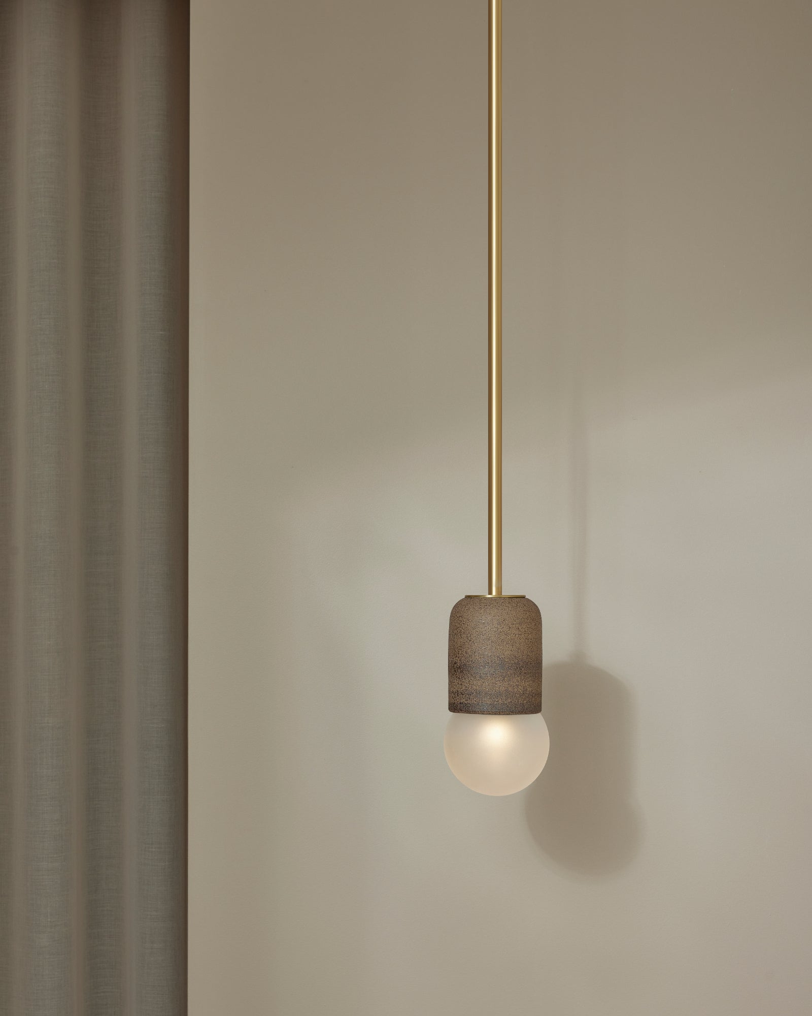 Terra 1 Pendant Light with clay ceramic finish and brass rod. -Nook Collections