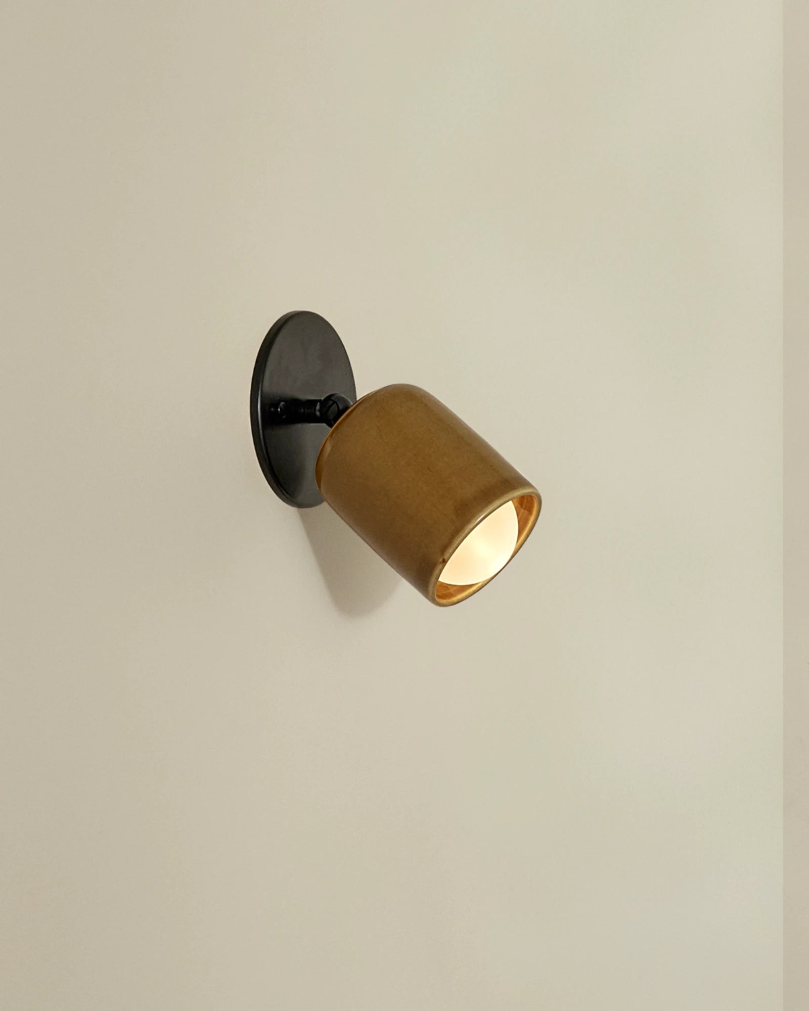 Terra 1 Short Arm Wall Light in Chartreuse ceramic and brushed black metal finish. -Nook Collections