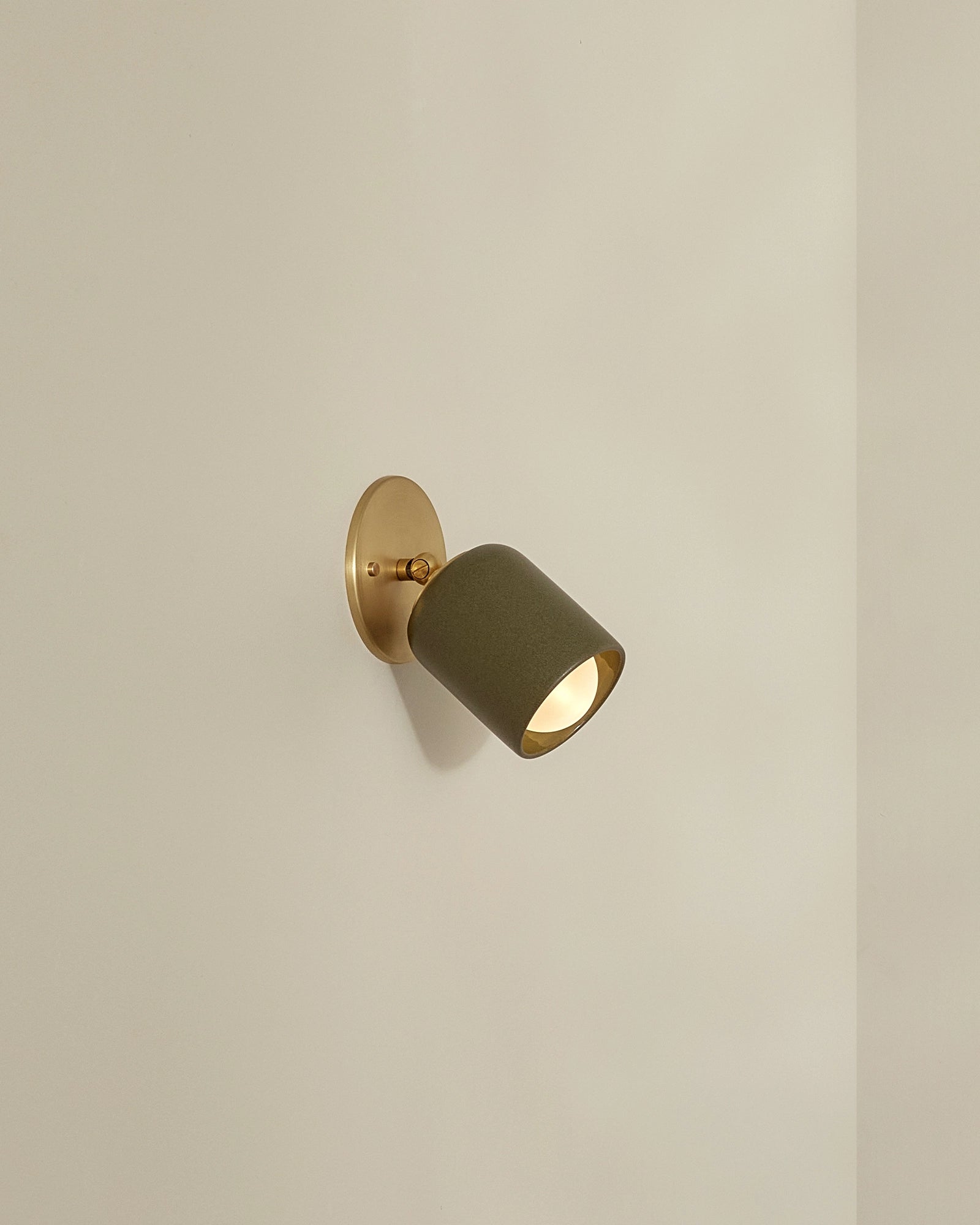 Terra 1 Short Arm Wall Light in Olive ceramic and brass metal finish. -Nook Collections