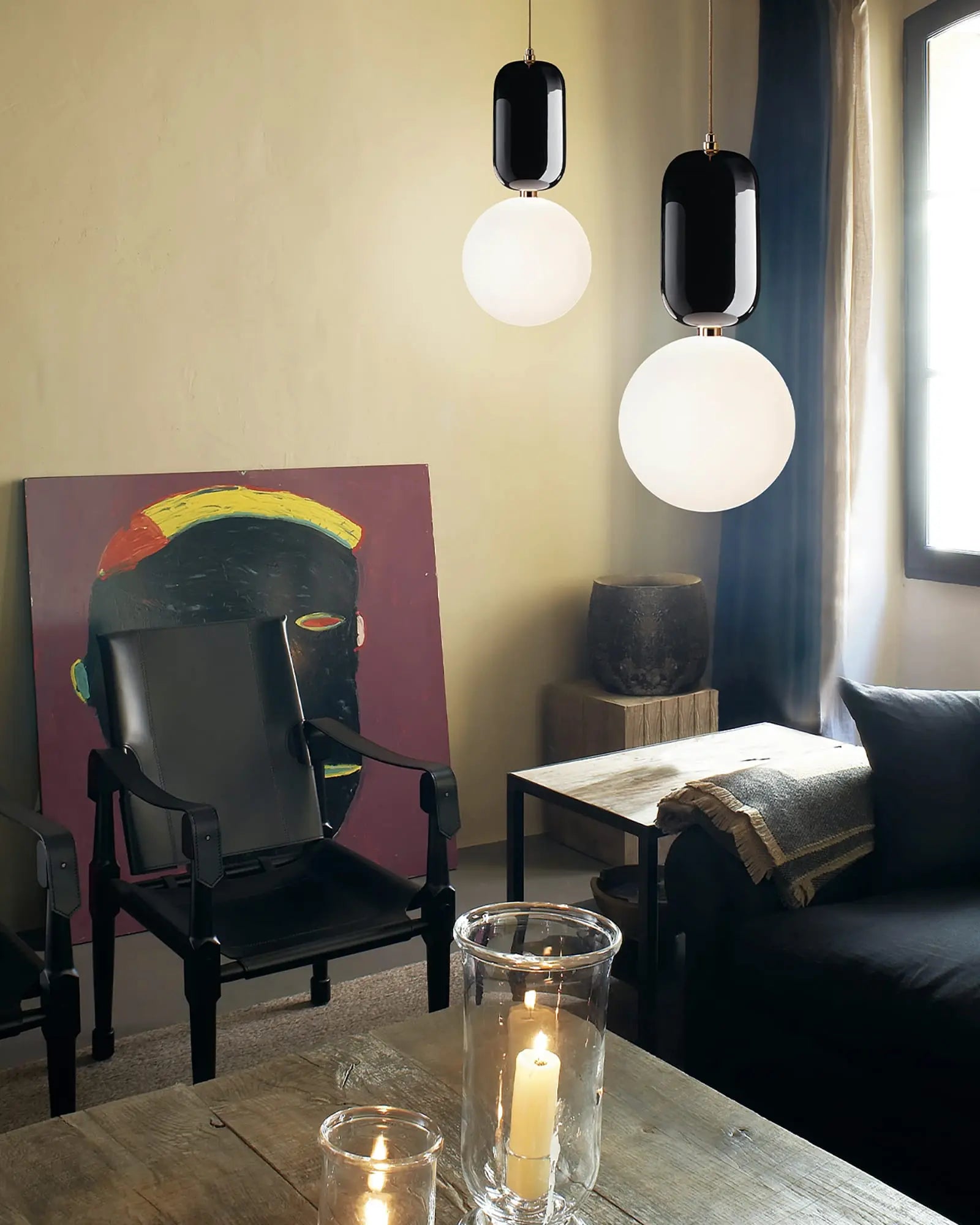 Aballs ceramic and orb blown glass shade pendant light above a coffee table