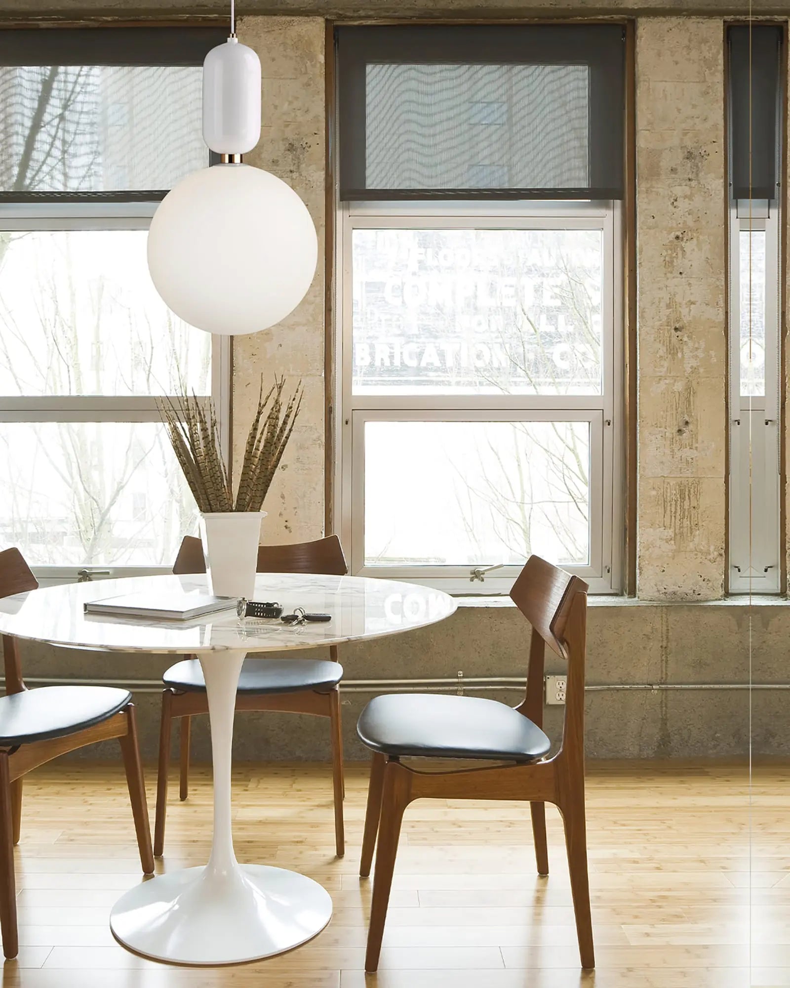 Aballs ceramic and orb blown glass shade pendant light above a round table