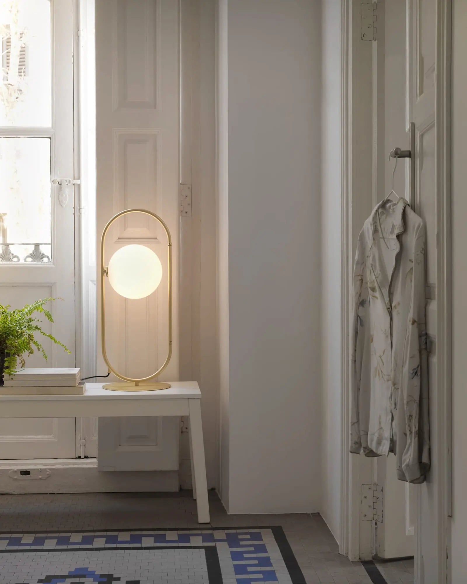 Abbacus contemporary brass and opal orb table light in a bedroom