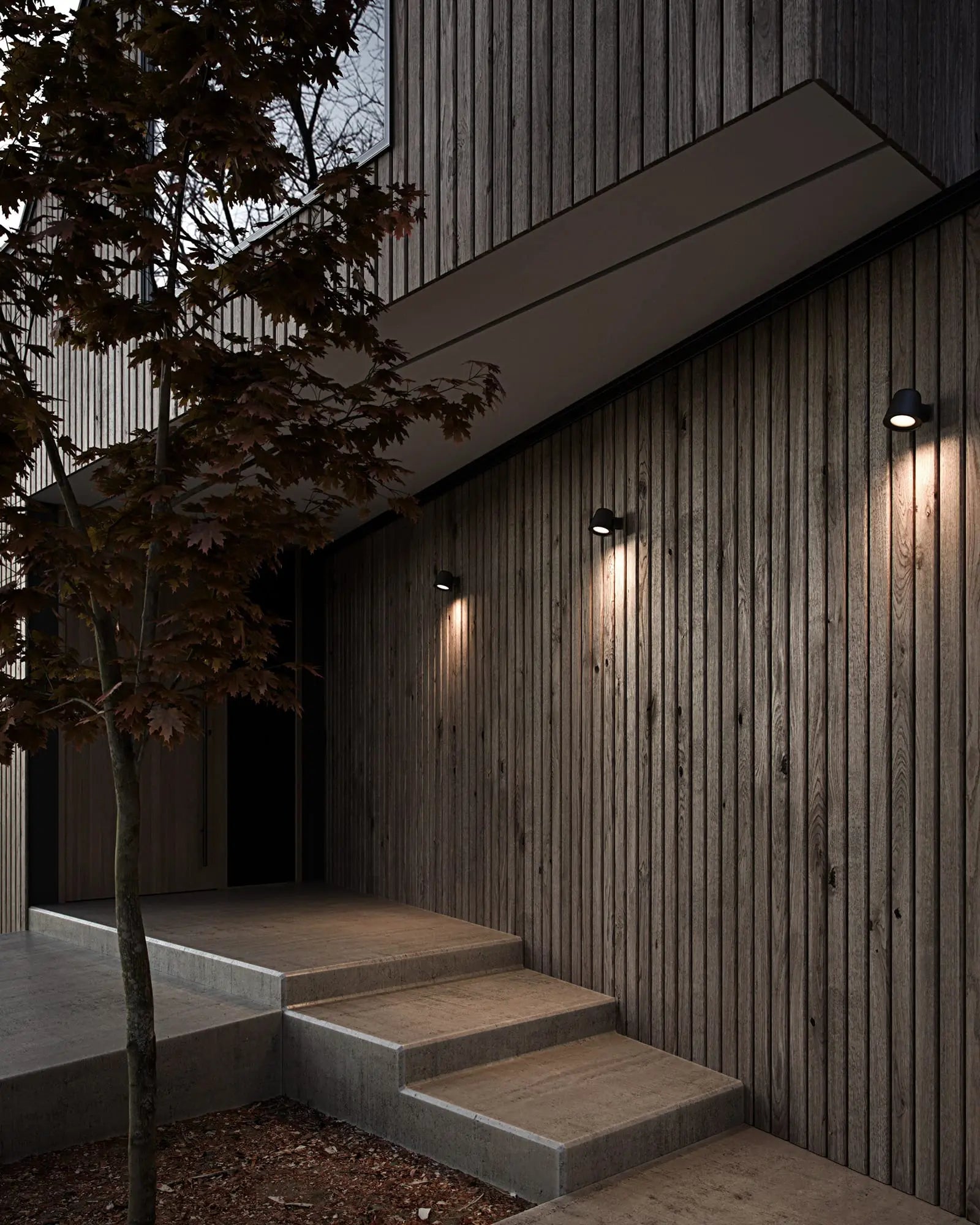 Aleria minimalistic Scandinavian Outdoor wall light in black cluster on a timber wall