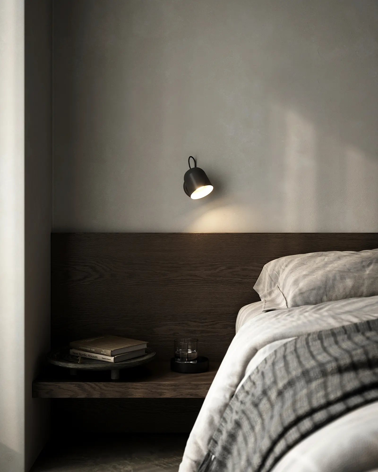 Angle adjustable Scandinavian wall light on the bed side