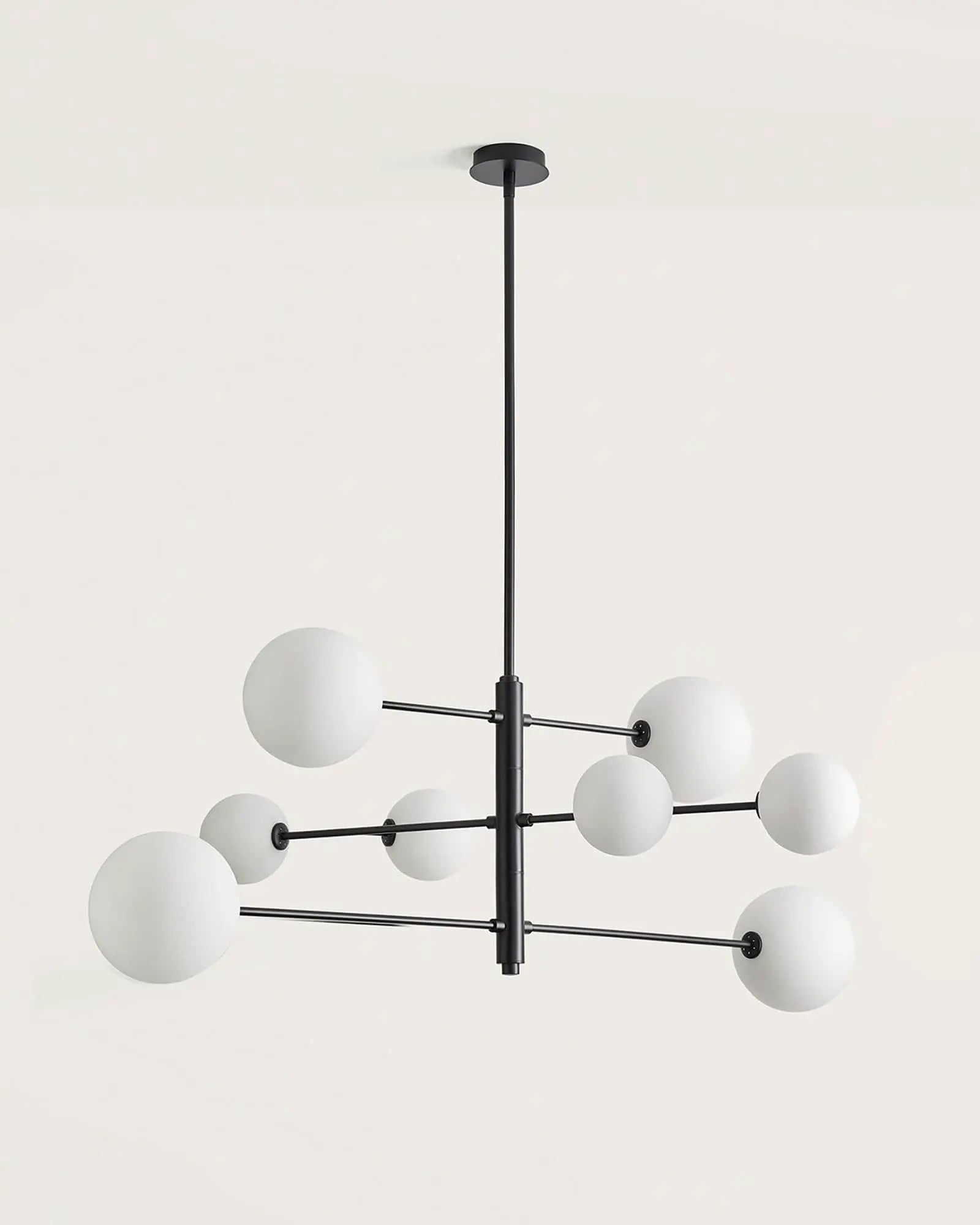 Atom contemporary adjustable pendant light in black and opal glass orb shades