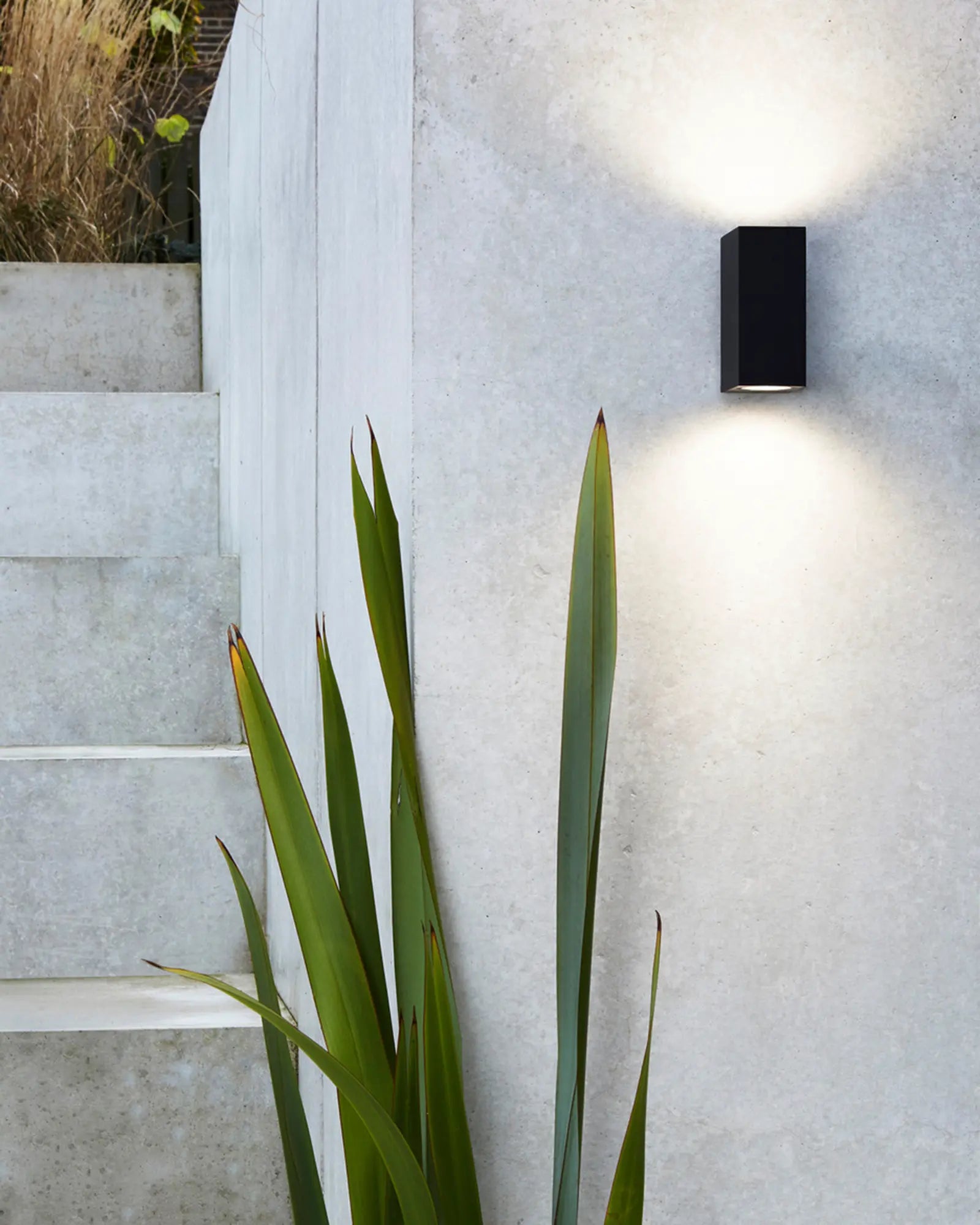 Chios Outdoor wall light in black up and down near a staircase