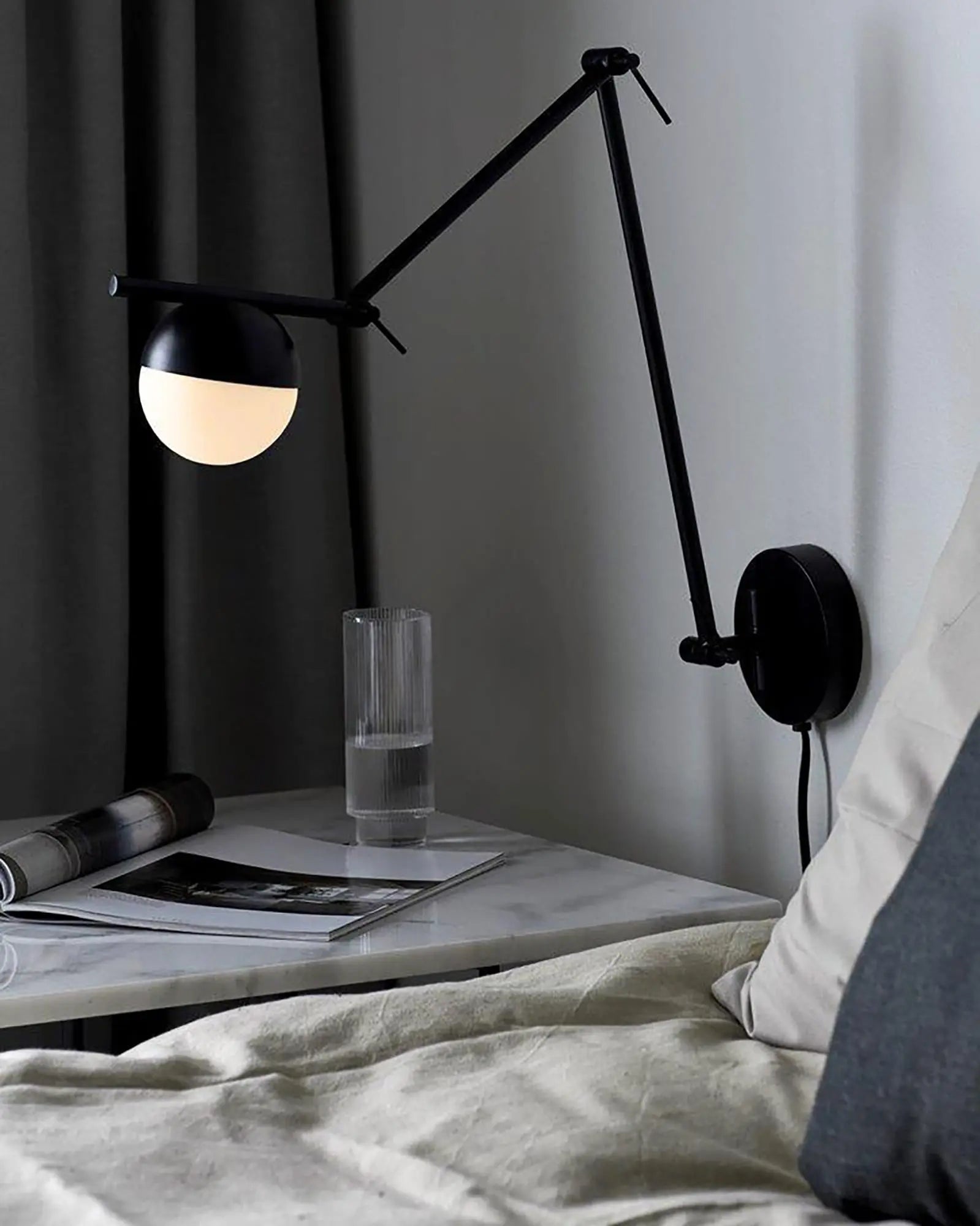 Contina adjustable minimal orb wall light bed side