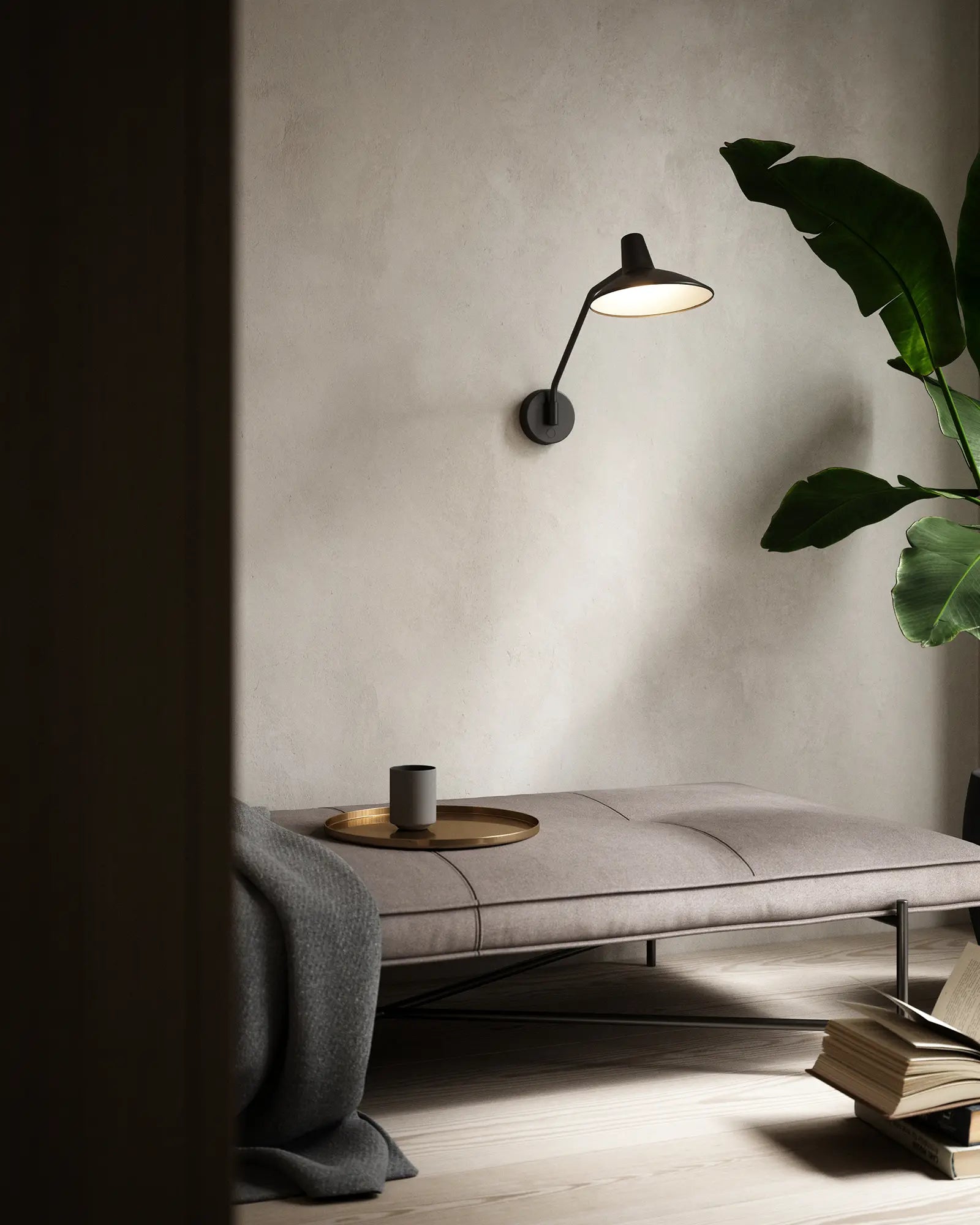Darci Wall Light in a lounge area above a seat