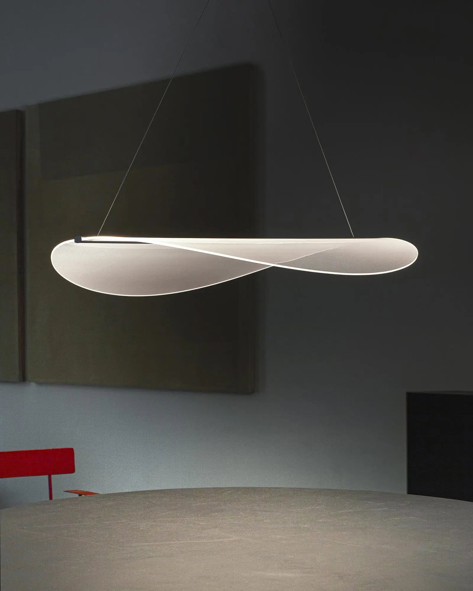Diphy pendant light above a table