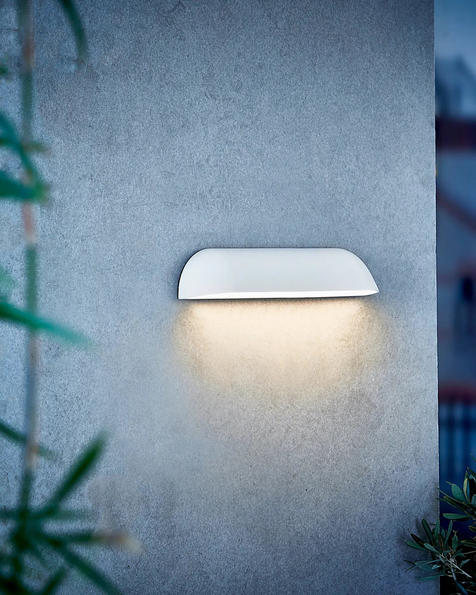 front outdoor scandinavian wall light on rendered wall