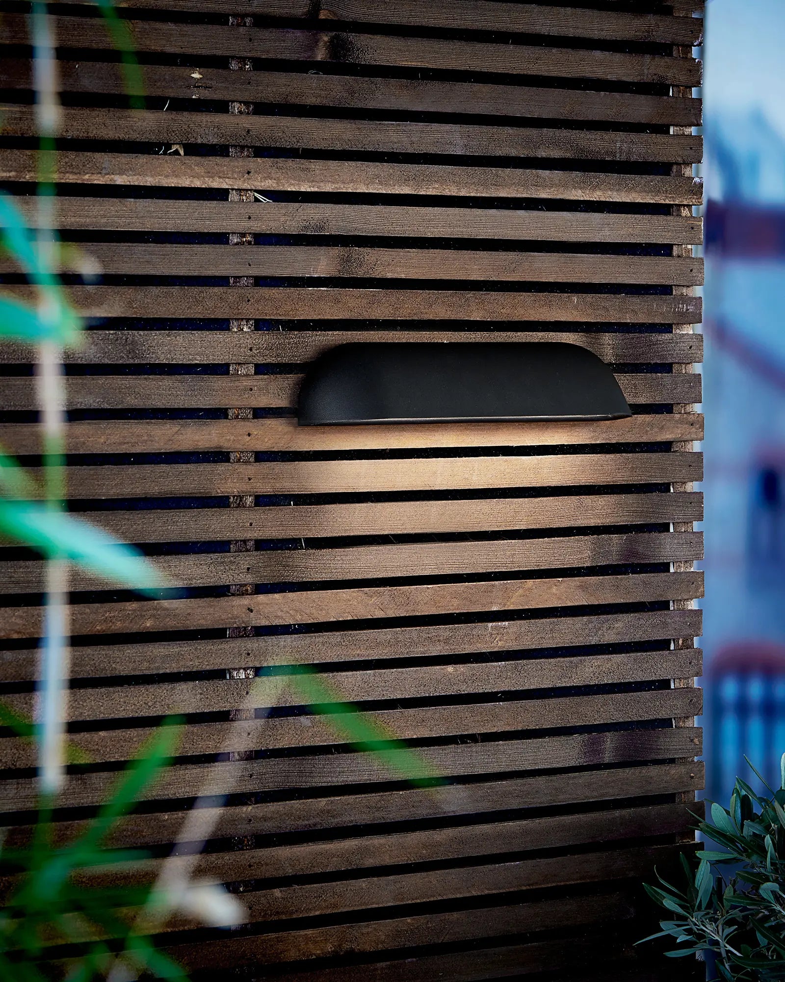 front outdoor scandinavian wall light on cladded wall