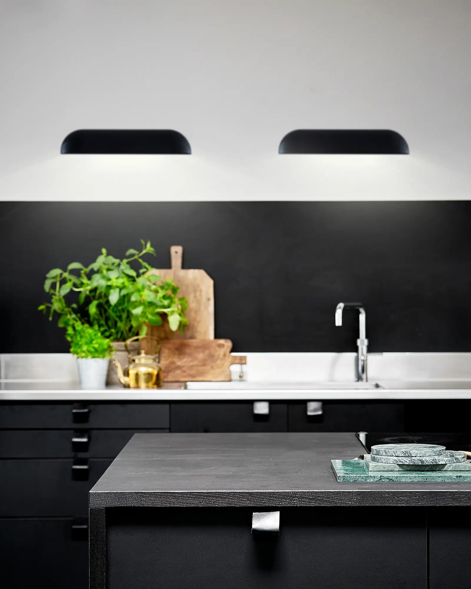 front outdoor scandinavian wall light abive a kitchen
