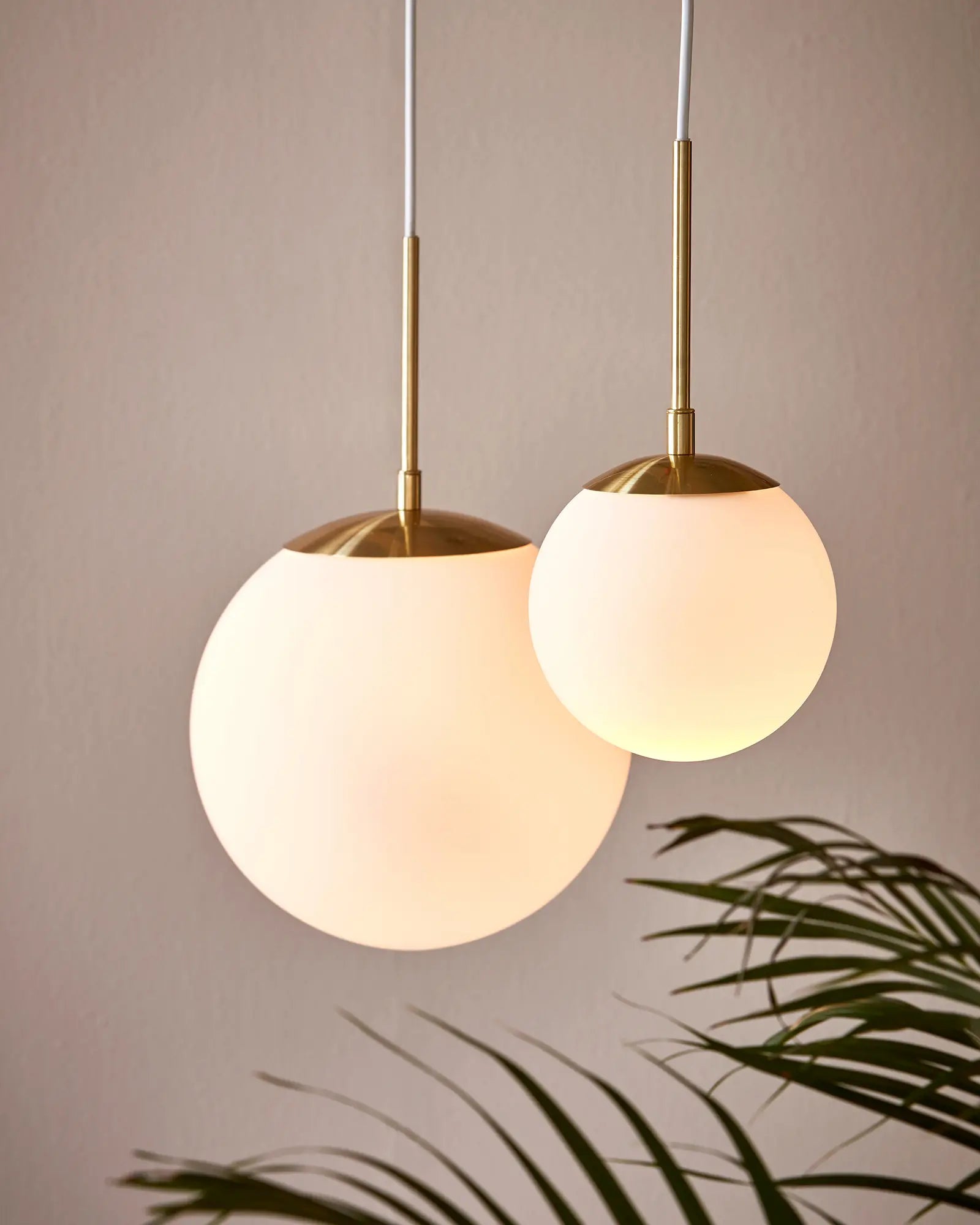 Grant orb pendant light in opal and brass cluster detail