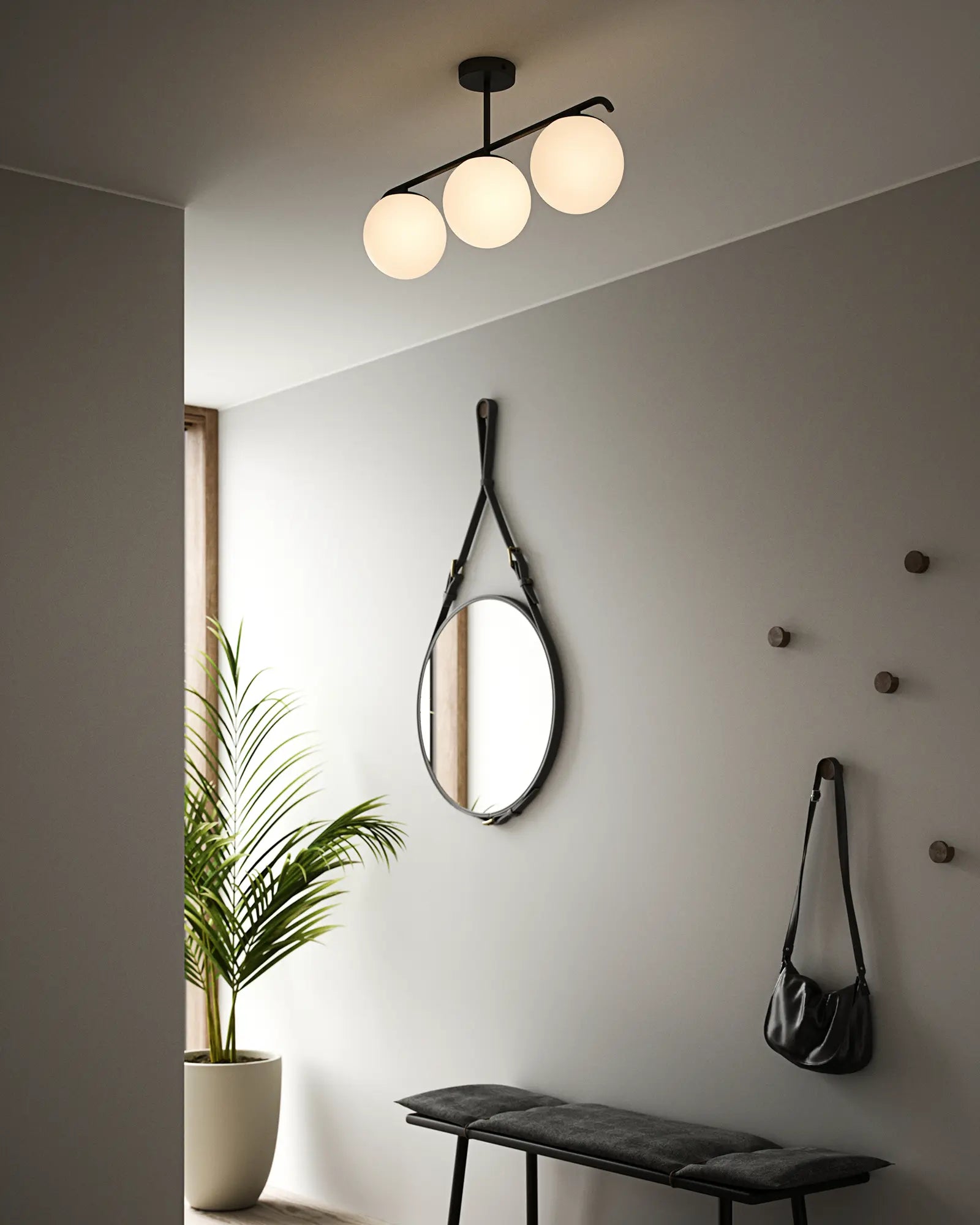Grant orb pendant light in opal and black 3 lights in an entrance
