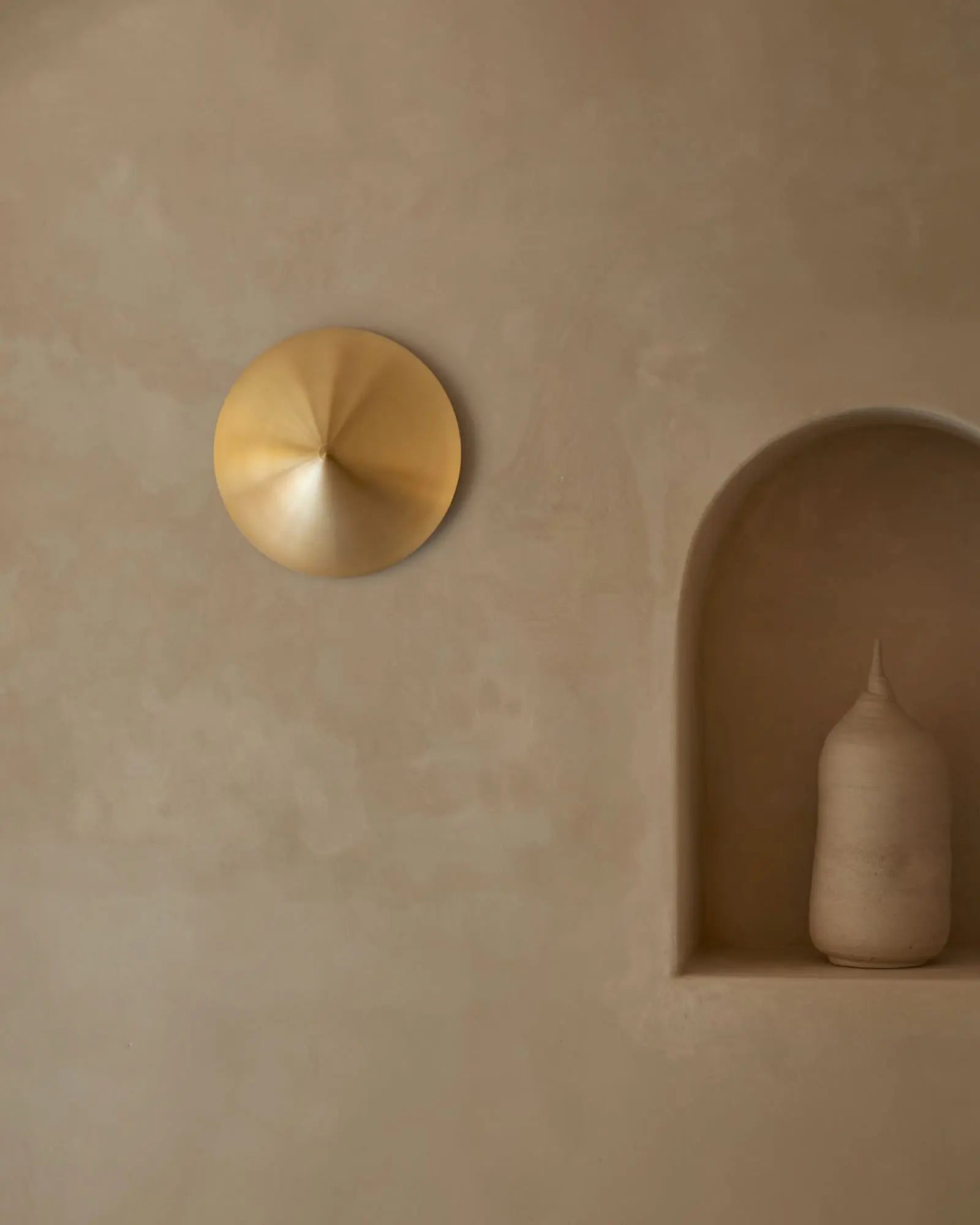 Hat wall light contemporary oriental inspire wall light in brass in hallway