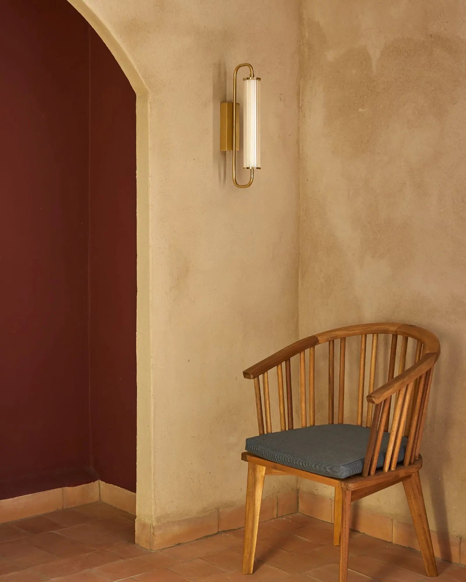 Ison wall light with ribbed glass shade in a lounge area