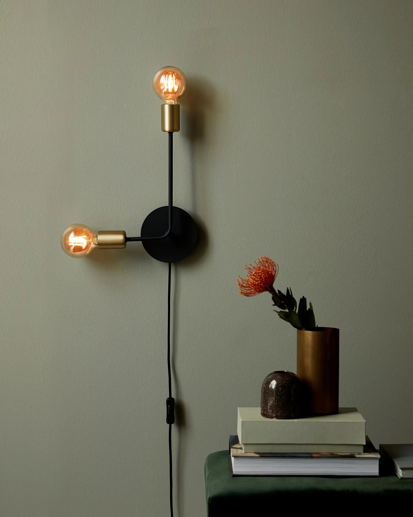 Josefine simple black and brass double light above a seat