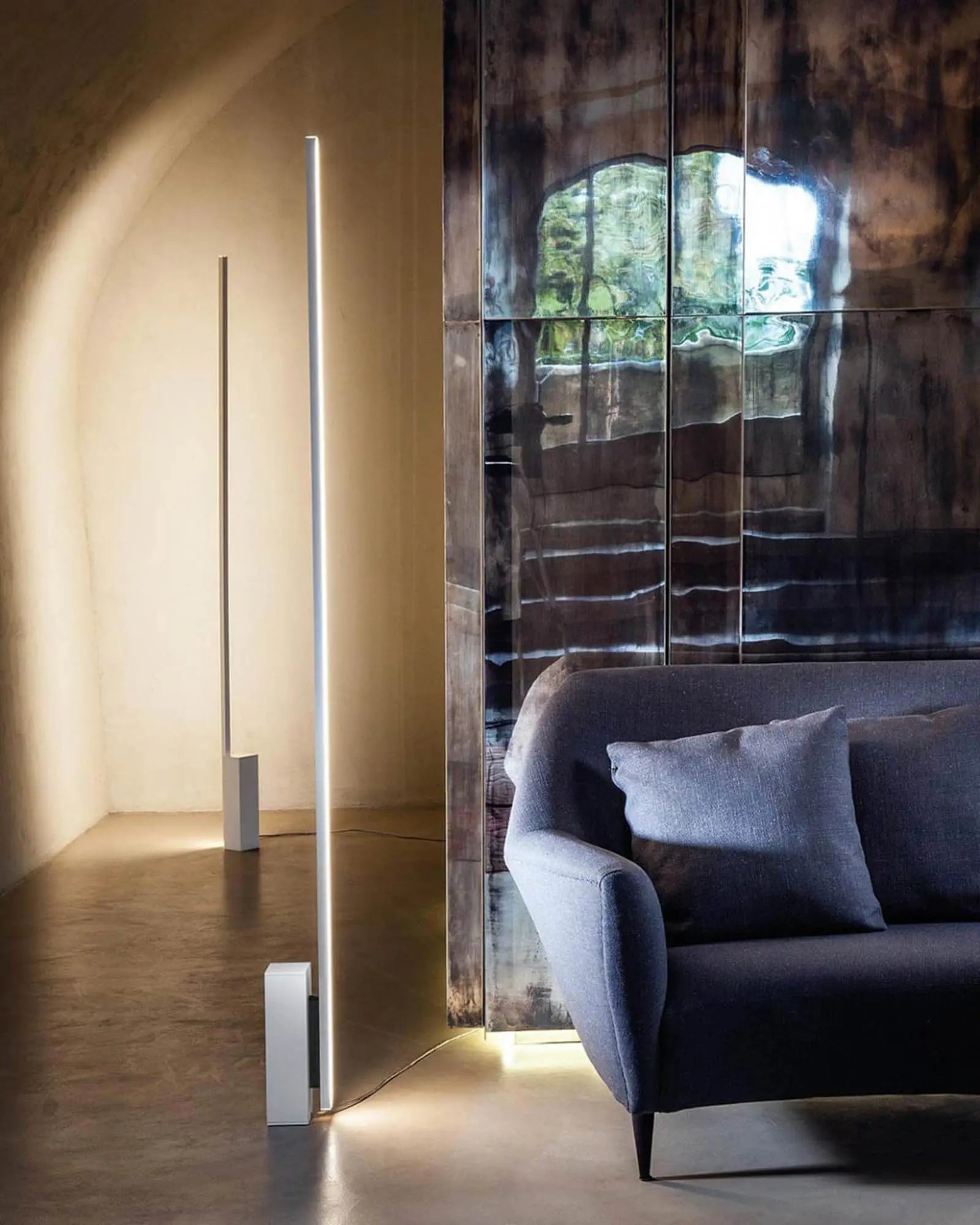 Linescapes modern LED floor lamp in white on a side of a sofa