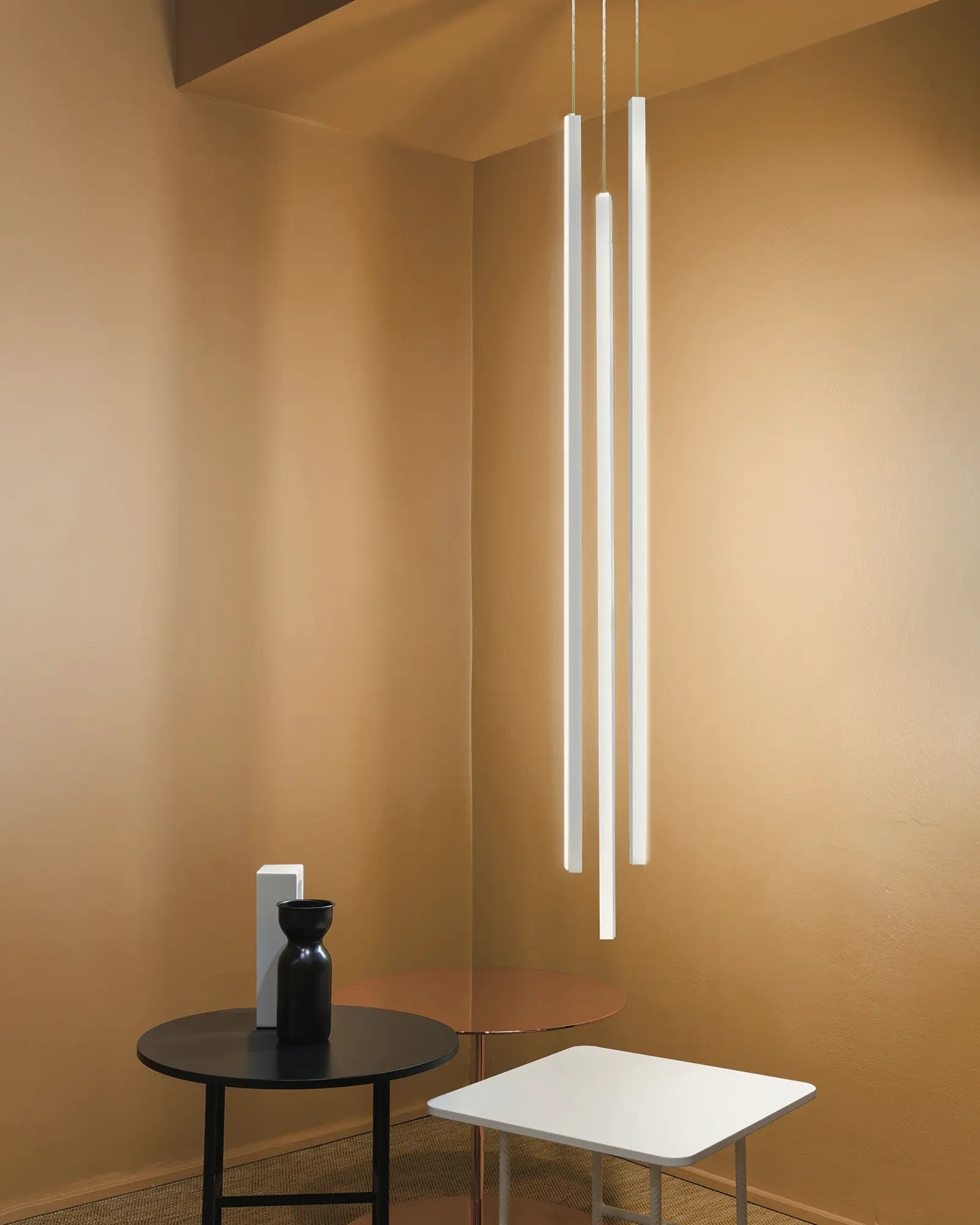 Linescapes vertical pendant above a coffee table