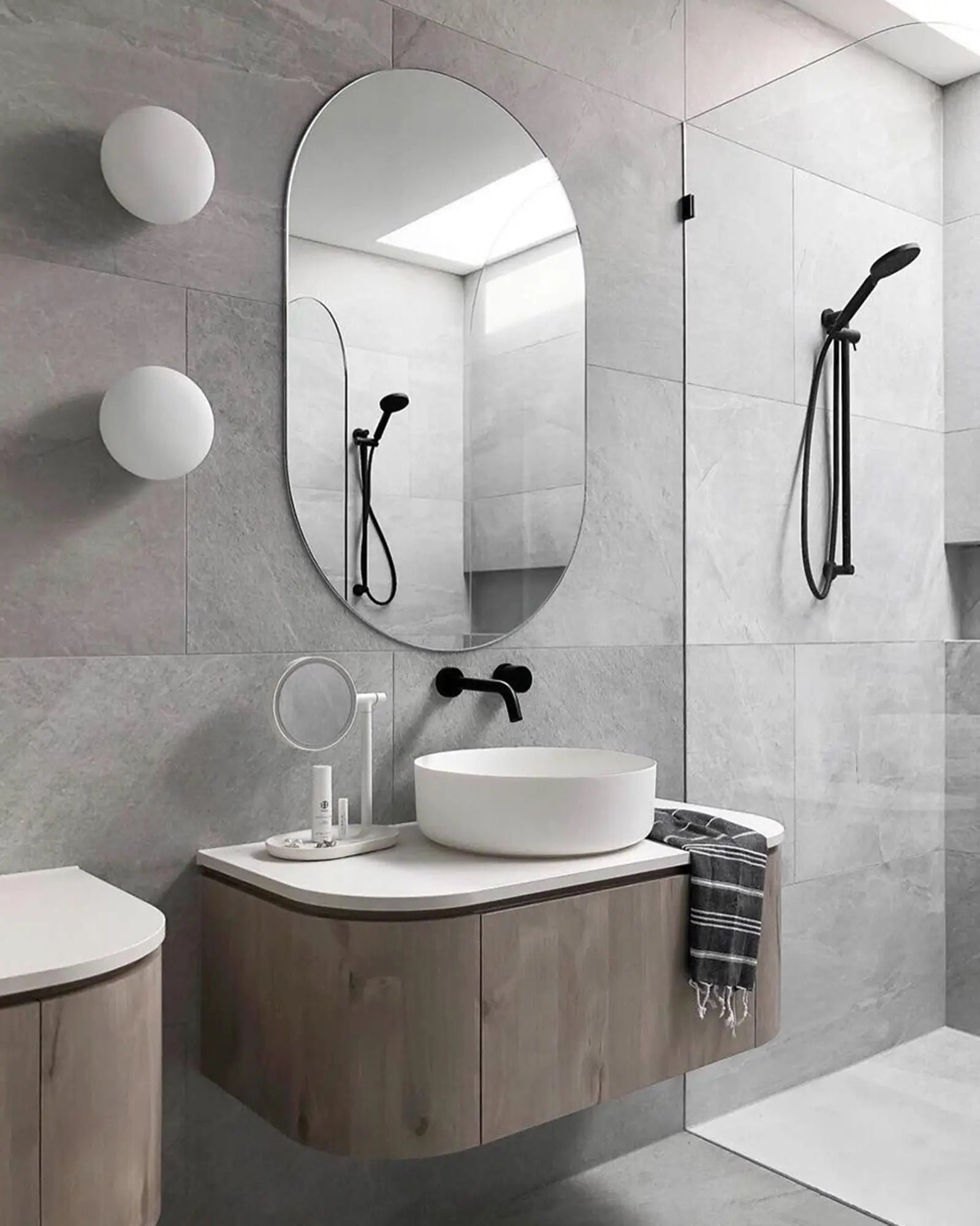 Lucciola wall light murano mouth blown glass orb cluster in a bathroom mirror side