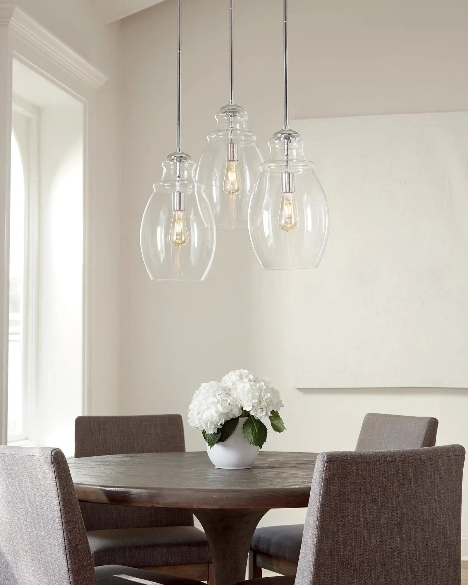 Marino blown glass pendant light cluster above a round table