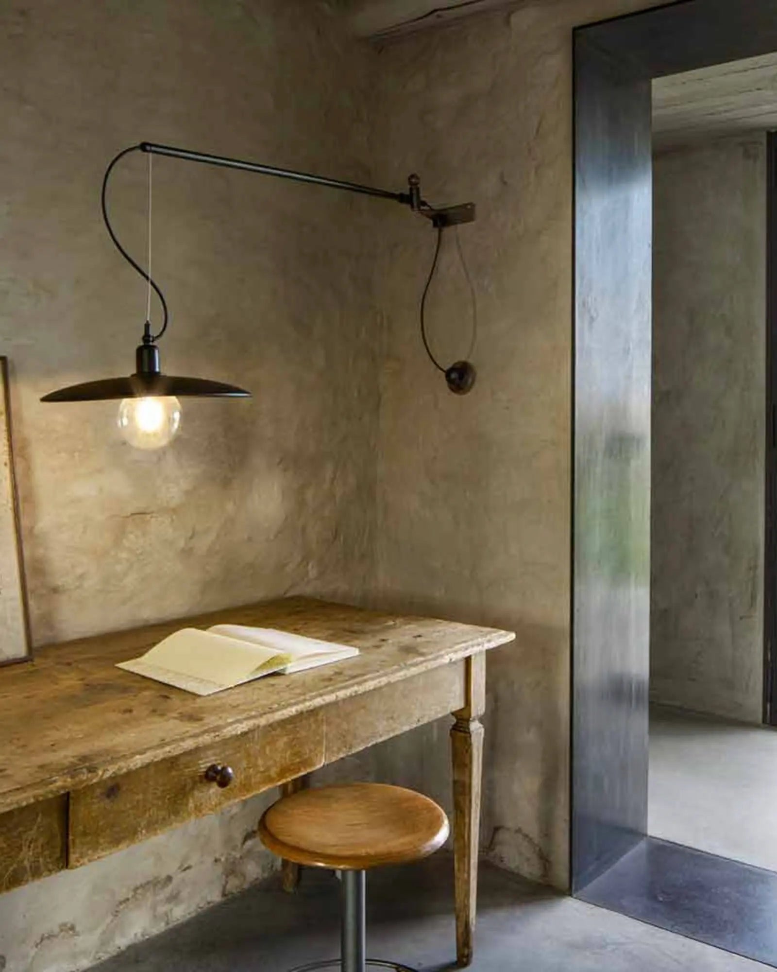Meridiana long arm wall light above a desk