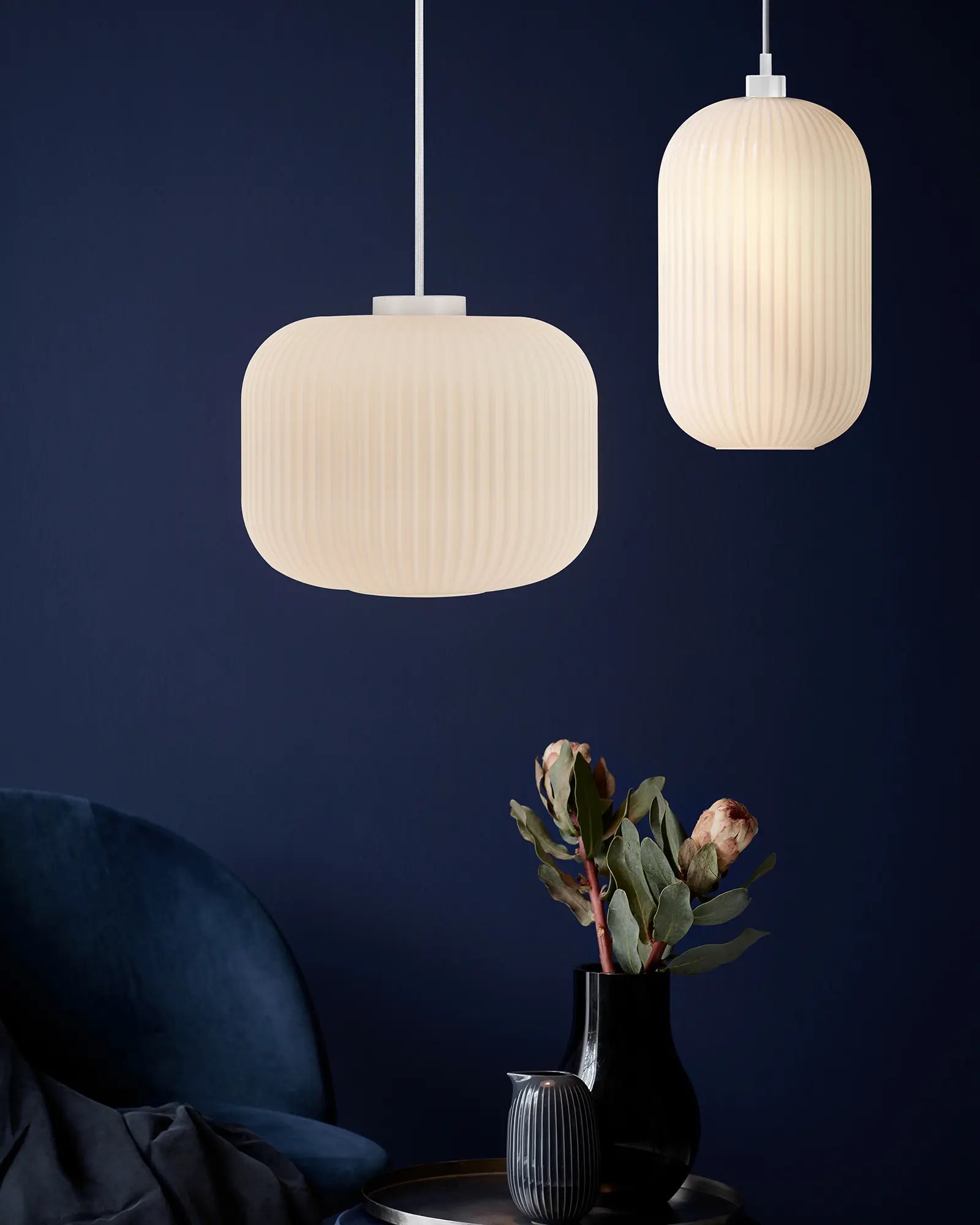 Milford opal glass and white pendant light Oriental lantern style cluster over a coffee table