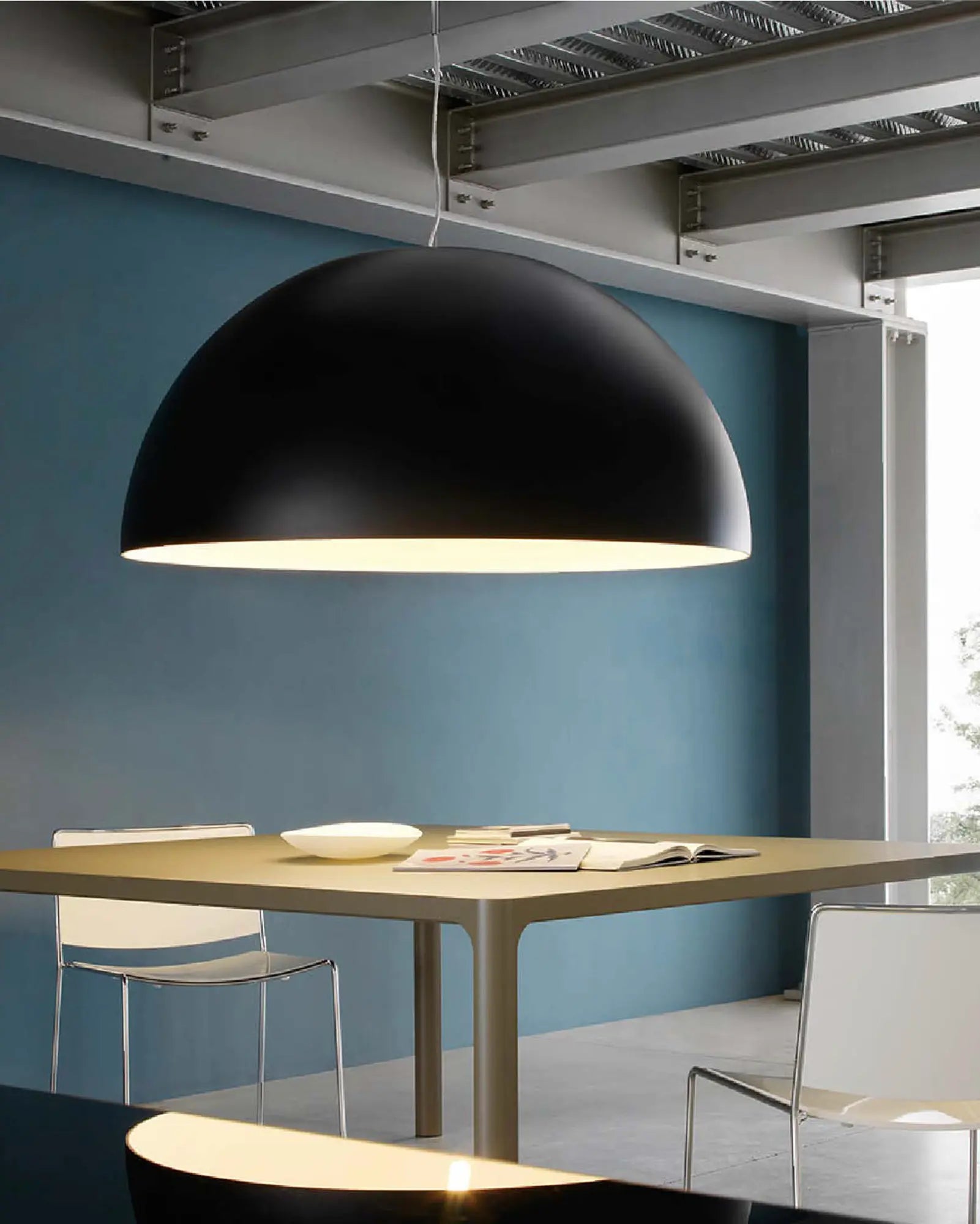 Moonlight pendant light above a table