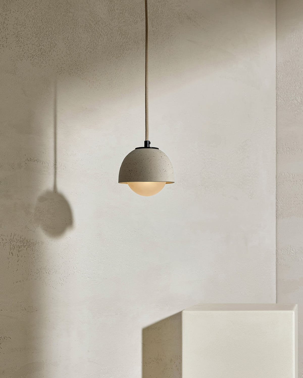 Terra 0 Pendant Light in Vanilla Bean ceramic finish with Brushed Black metal finish. - Nook Collections