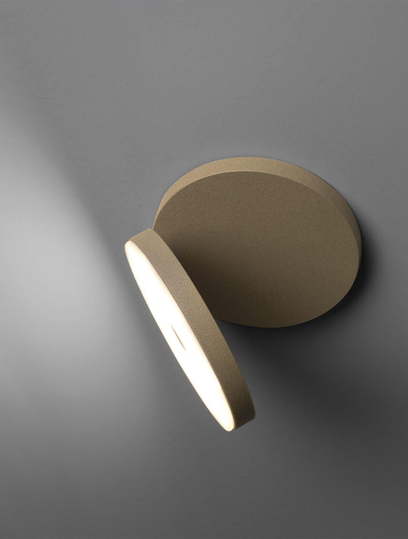 Olimpia modern adjustable round bedroom wall light by Cattaneo sandy