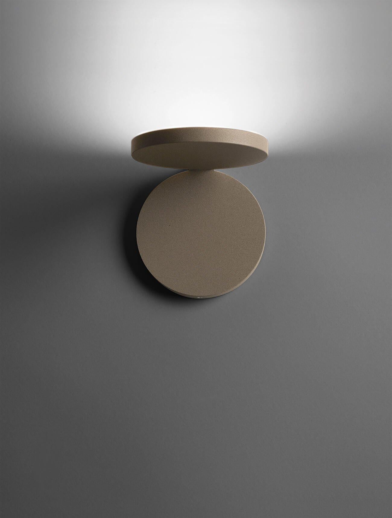 Olimpia modern adjustable round bedroom wall light by Cattaneo sandy