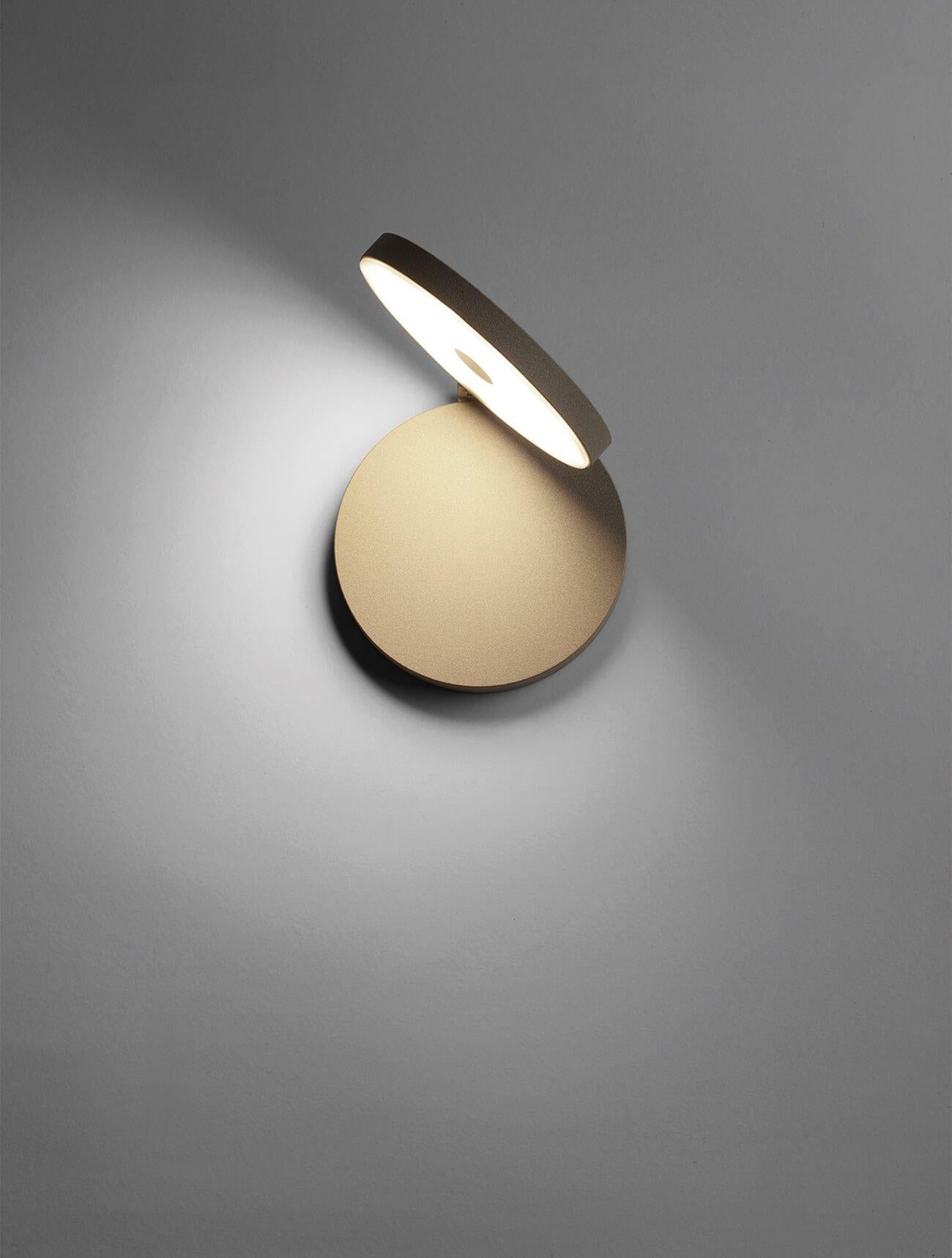 Olimpia modern adjustable round bedroom wall light by Cattaneo sandy