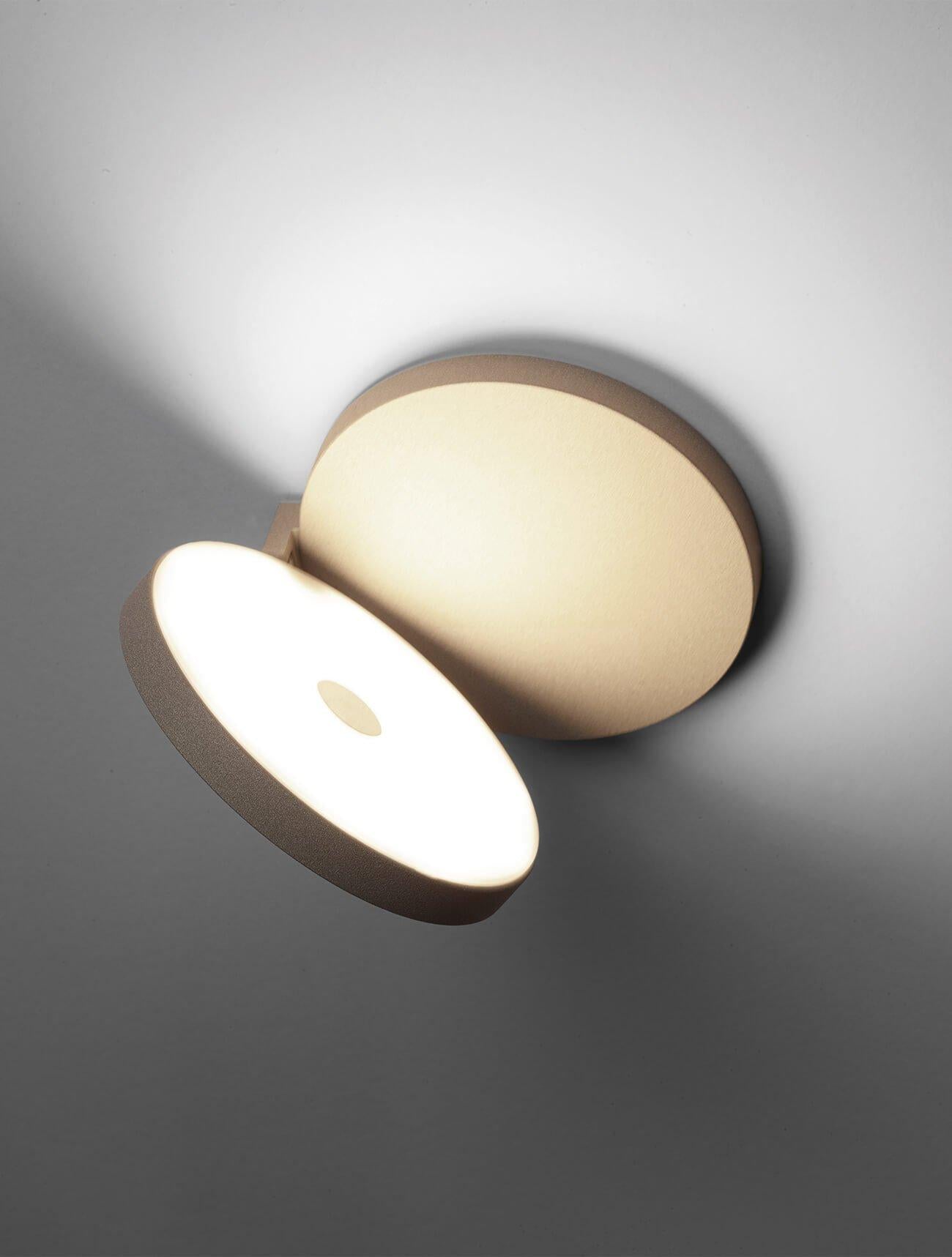 Olimpia modern adjustable round bedroom wall light by Cattaneo sandy