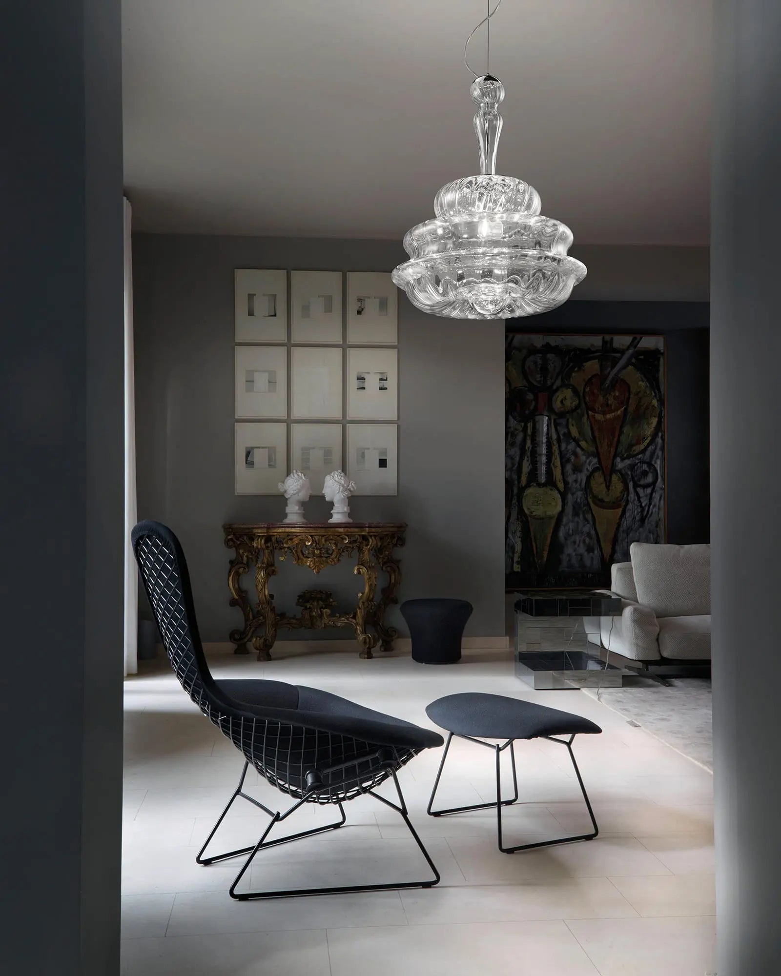 Novecento classic blown Murano glass pendant above a chair in a living area