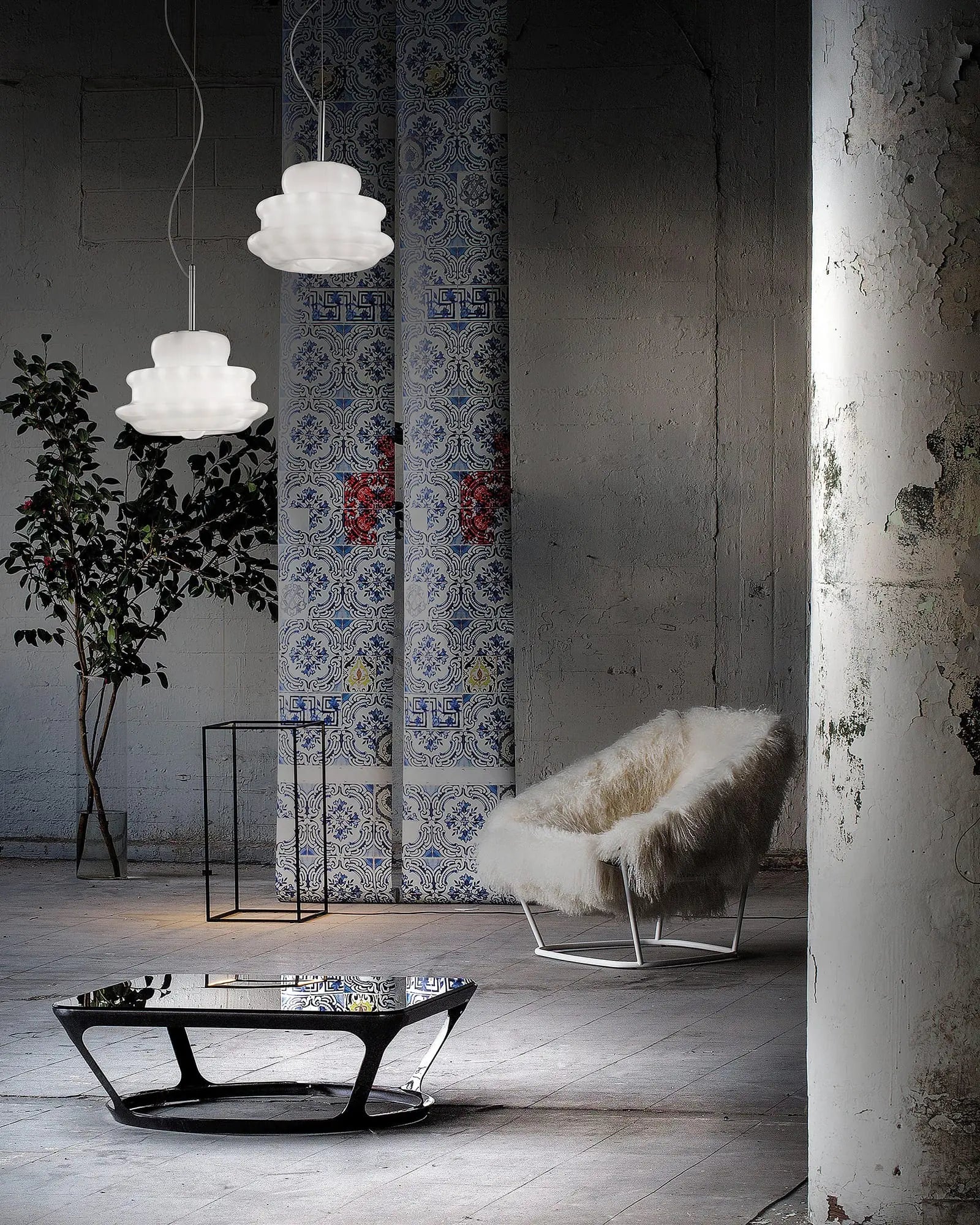Novecento classic blown Murano glass pendant cluster above a coffee table in a living area