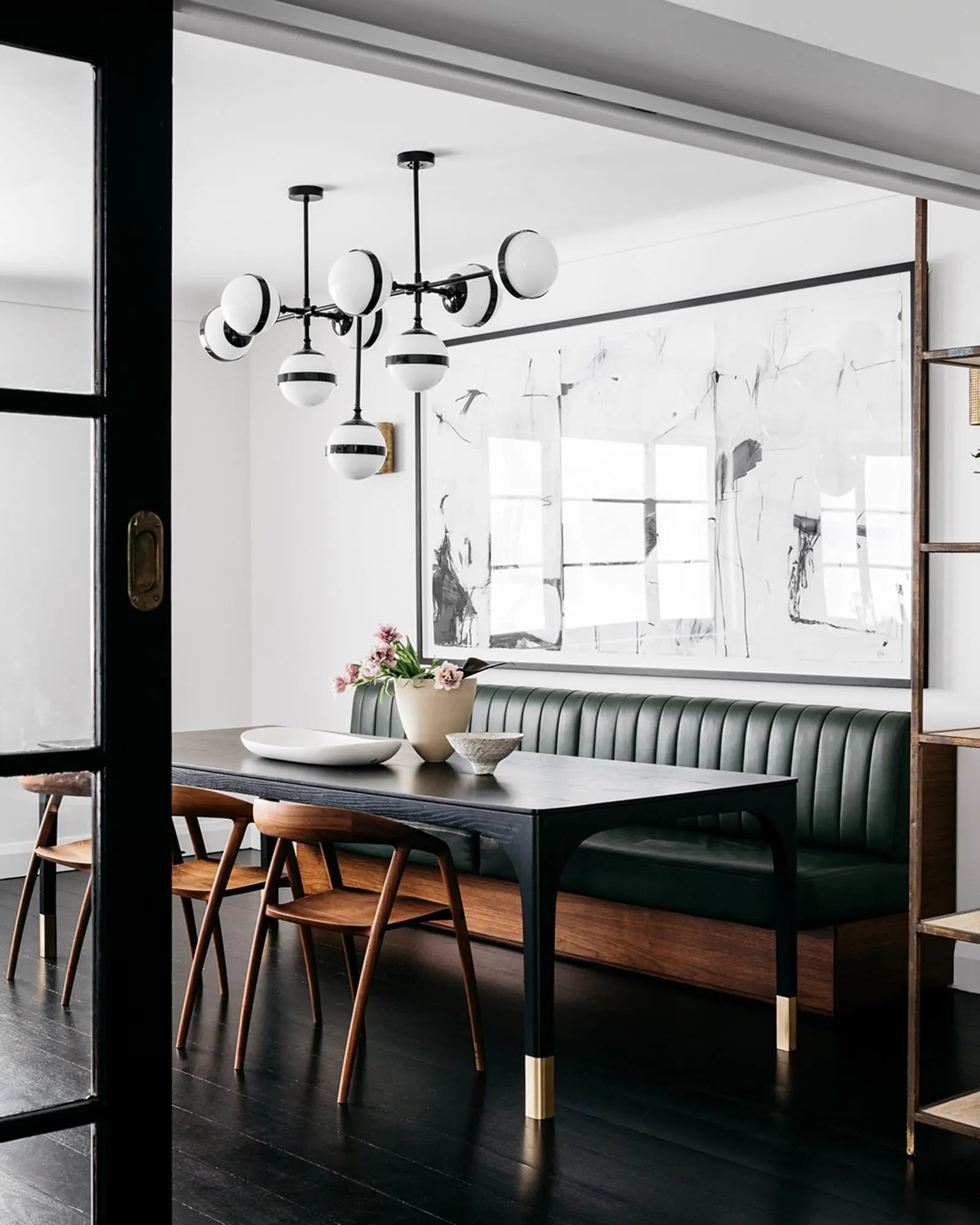 Peggy 9 orbs shade contemporary pendant over a dining table