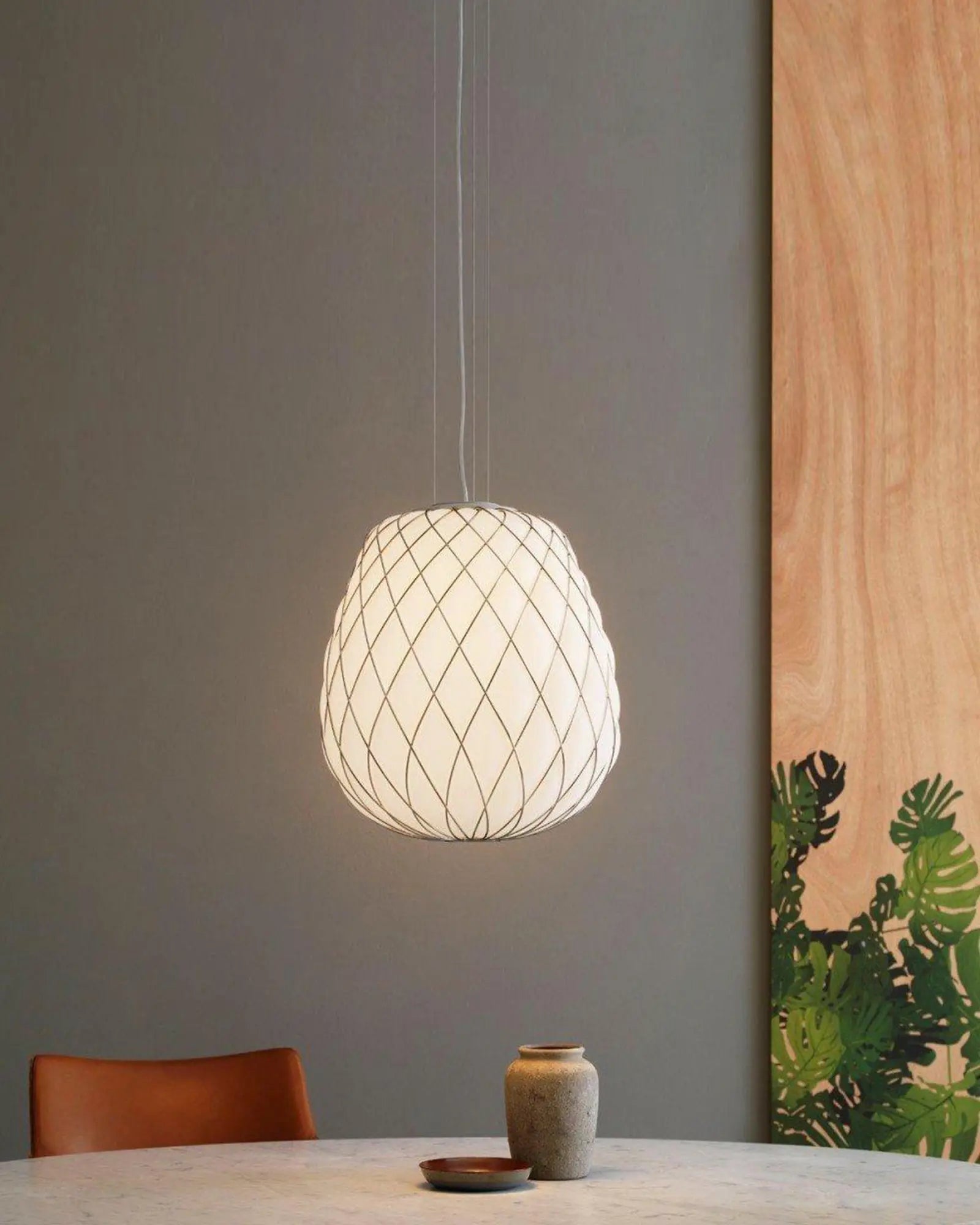 Pinecone pendant light above a table